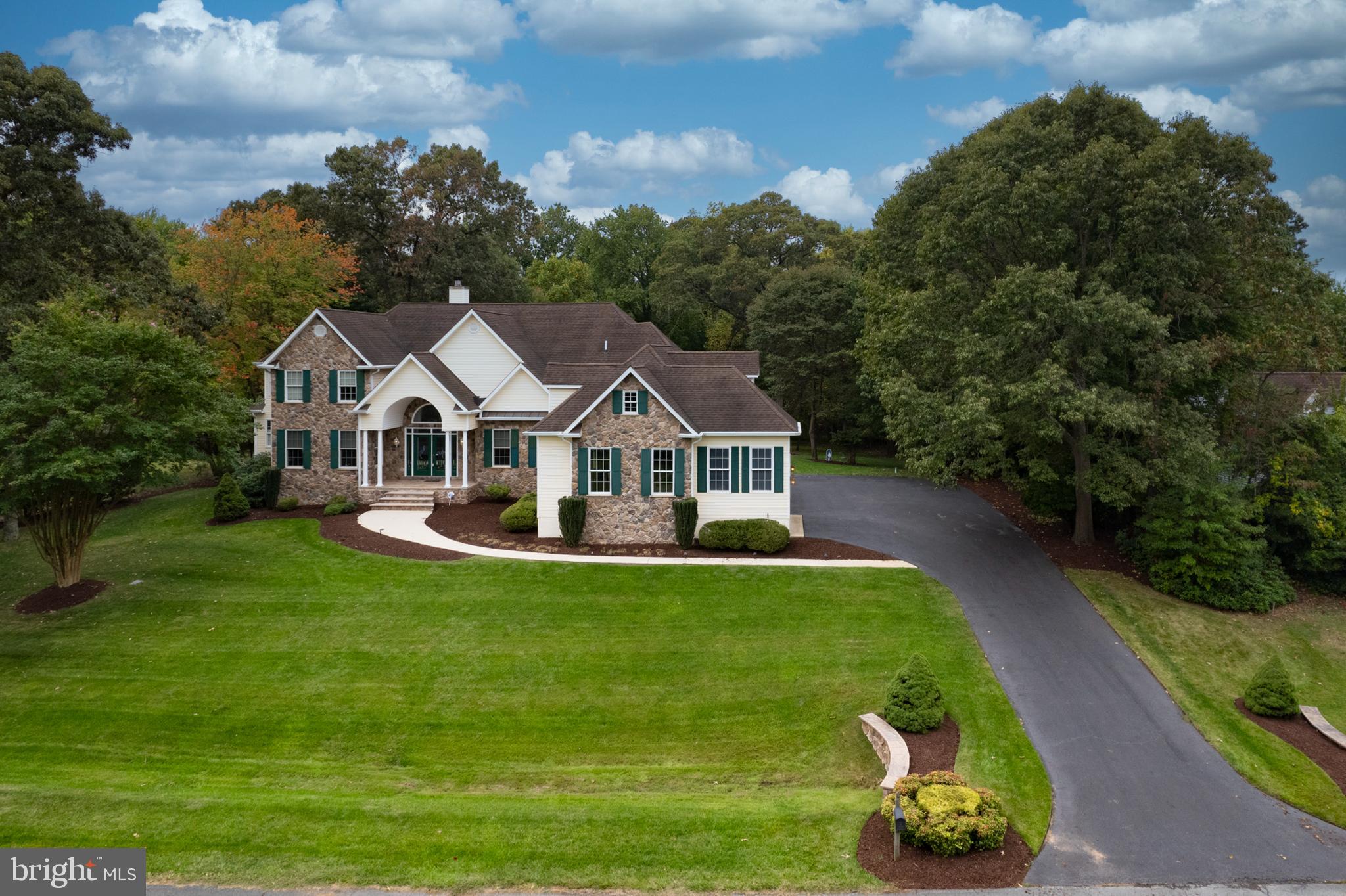 Welcome to 7730 Water Oak Point Rd in Pasadena, where luxury meets comfort in this stunning custom colonial home. Built in 2008 by the original sellers, this 3-story masterpiece is situated on a spacious 1.03-acre lot in the prestigious Chandler Point subdivision. As you approach the home, you'll be captivated by the grand brick exterior and peaks of the roof line. Now, as you walk thru the exquisite stained glass double front door you’ll be greeted by a breathtaking 2-story foyer adorned with an artful chandelier hand crafted in the New Orleans French Quarter! Note the chandelier can be lowered with a special key for easy cleaning!  

The main level boasts a cozy great room with a stone-front fireplace, plenty of windows, and gleaming wood floors. The chef's dream kitchen features a kitchen bar, sunny breakfast nook, granite countertops, plenty of storage and top-of-the-line stainless steel appliances. A convenient laundry room with a full bathroom is also located on this level. The detail in this home is unparalleled, in fact pay special attention to the archway between the dining room and kitchen, see the ornate molding - what a special detail!  This home has straight lines, archways, and ceiling decor that create a sense of elegance and sophistication. 

The first-level primary bedroom offers a peaceful retreat with ample windows overlooking the backyard, a coffered ceiling, and a luxurious ensuite bathroom with a separate walk-in shower (with a rain shower head!) and jacuzzi tub. Upstairs, you'll find three additional bedrooms, each with its own attached full bathroom. There is a hallway bathroom for added convenience. There is a 2nd laundry room, and 2 additional flex rooms that can be used for office space, playroom space, bedroom, whatever you decide! 

The lower level is a spacious area that can be used as a recreational room or an in-law suite, complete with a second full kitchen, a bedroom and full bathroom. There is also a room being used for a game room but can be changed into any other use. There is a gym space as well.

Outside, the expansive backyard and huge deck provides the perfect setting for outdoor entertaining and relaxation. Watch as wildlife walks by, and birds visit your birdfeeders while you unwind in the tranquility of your very own private oasis. With a 3-car garage and custom finishes throughout, this home is truly a rare find.  PLUS, some great community amenities: water access to Rock Creek, Oak Harbor Marina, Compass Pointe Golf Courses, multiple recreational parks, local shopping and restaurants!!! Don't miss your chance at this exceptional opportunity in Pasadena. Schedule a showing today and make your dream home a reality at 7730 Water Oak Point!   8500+ Finished square footage !!!!