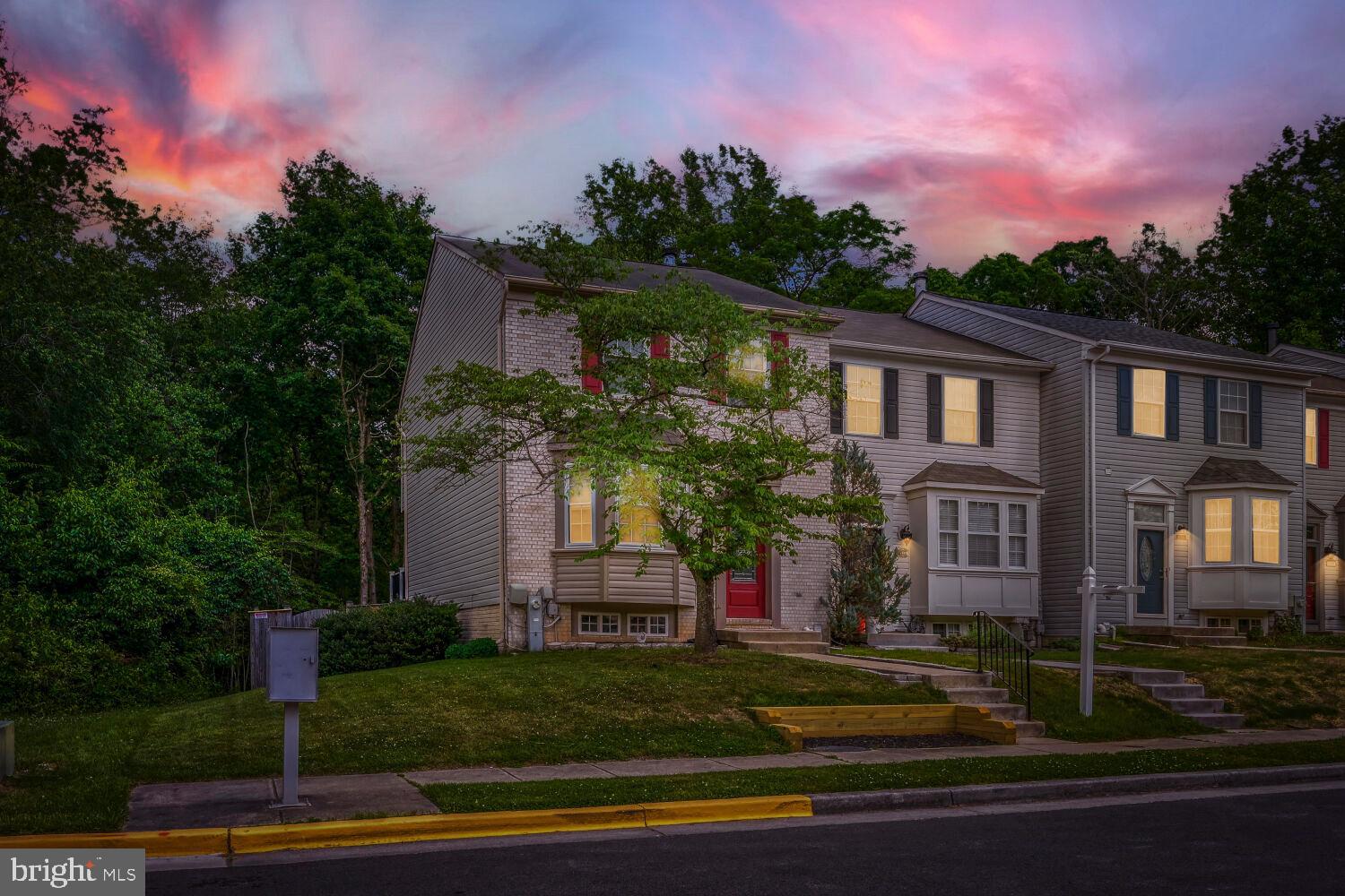 Stunning, move-in ready end-unit townhome offering exceptional space, privacy, and thoughtful updates throughout. With approximately 1,847 sq ft of well-designed living space and 4 bathrooms, this home delivers comfort and flexibility for today's lifestyle. The refreshed kitchen shines with a beautiful bay window, stainless steel appliances, a dedicated coffee bar, and a bright, neutral palette. Step out to the private Trex deck for a peaceful outdoor escape with wooded views. The finished basement adds valuable living space anchored by a cozy fireplace, with a sliding glass door opening to a patio and a fully fenced yard — a rare find in any townhome community, perfect for pets or entertaining. The primary suite impresses with a vaulted ceiling, custom walk-in closet with built-in shelving, and a spa-inspired bath with dual vanities. A fully remodeled bedroom-level bath (2026) rounds out the exceptional bath count. Recent updates include: Trex decking, primary closet shelving, bedroom-level bath remodel (2026), new light fixtures throughout, newer washer & dryer, and updated windows. Community amenities include a playground. This one truly has it all — schedule your showing today.