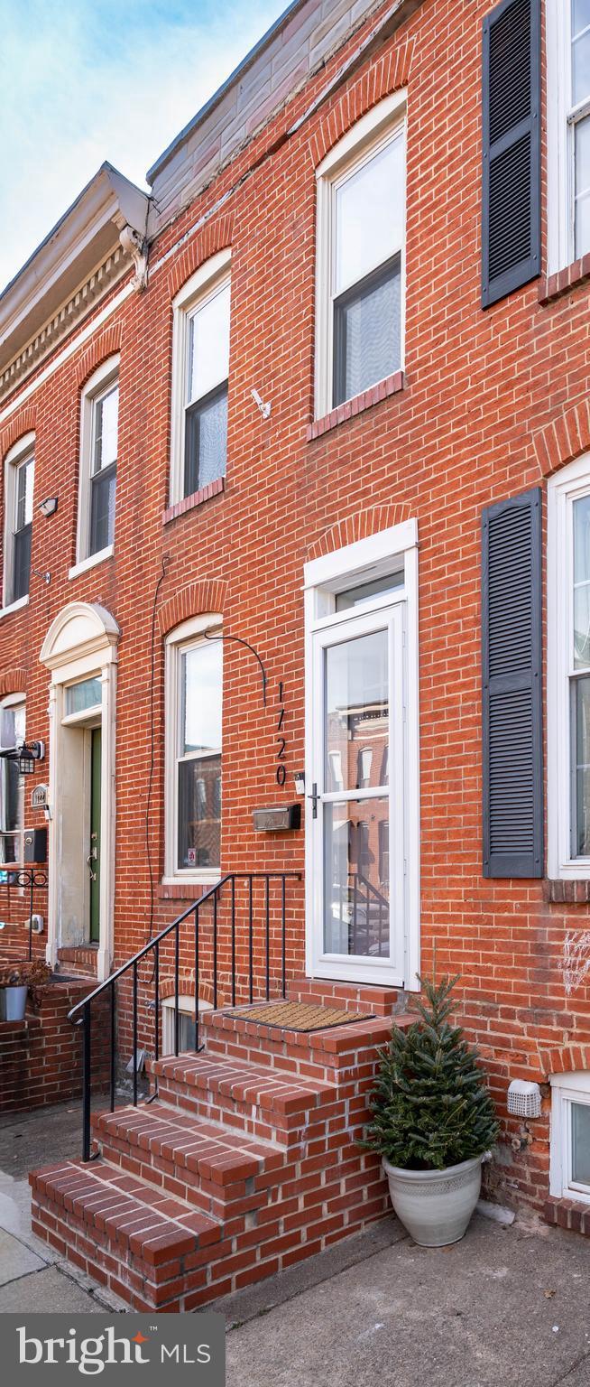 Steps to Riverside Park! Classic city charm meets thoughtful modern updates at 1720 Byrd St. This refreshed 2-bedroom, 1.5-bath brick townhome is tucked into Federal Hill, just steps from Riverside Park and surrounded by some of the area's best dining and neighborhood favorites. The home features brand-new flooring throughout and beautifully remodeled bathrooms completed within the last two years. The living space is cozy yet stylish, highlighted by a new electric fireplace, custom built-in shelving, and detailed custom trim that adds character and craftsmanship.  The kitchen leads to the back yard--perfect for BBQs or enjoying some urban green space. The back is fully fenced and had low-maintenance turf. Upstairs you'll find two spacious bedrooms, plus a full bath with custom tile and a glass shower door fora  spa-like feel.  The basement offers exceptional storage with a convenient bin wall system, keeping everything organized and out of sight. Easy access to the laundry makes this chore a breeze. With its timeless brick façade, move-in-ready updates, and unbeatable location near parks, restaurants, stadiums, attractions, and waterfront fun, this Federal Hill townhome is the perfect blend of comfort, style, and city living. Don't wait--schedule a visit now!