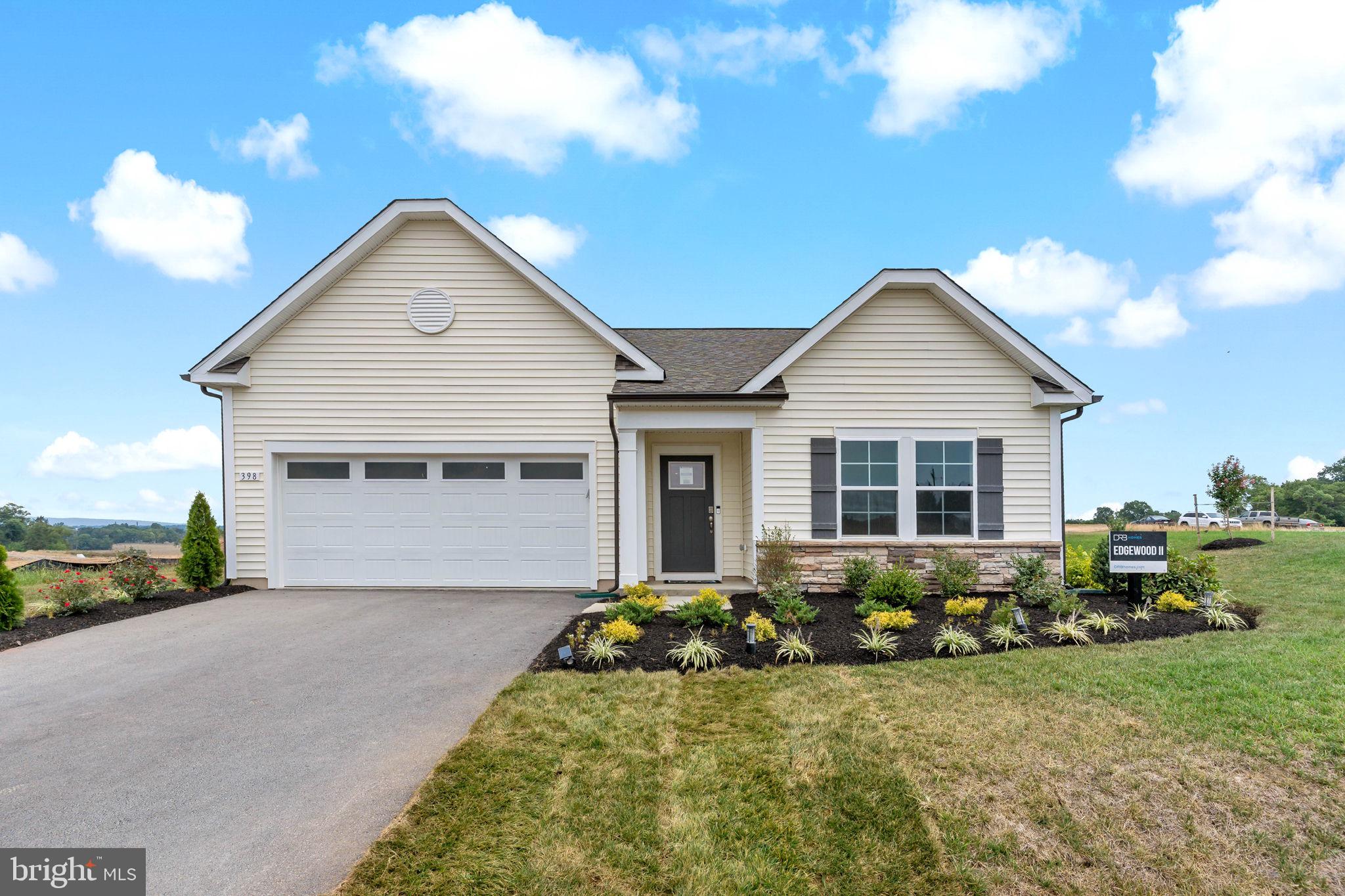 The most affordable single-family homes in the City of Martinsburg with a design studio experience!
**NOW OFFERING UP TO $12,500 IN CLOSING COST ASSISTANCE FOR PRIMARY RESIDENCE WITH USE OF APPROVED LENDER AND TITLE.*
BRAND NEW PHASE OF THE GALLERY SINGLE FAMILY HOMES! The largest one level home available in The Gallery Subdivision! Efficiency at its finest is found in the Edgewood. This one-story home boasts 3 bedrooms and 2 full bathrooms. You and your guests will be greeted by a long, elegant entry leading to an open kitchen and family room. Two secondary bedrooms share a hall bath with a generous laundry room close by which opens to the attached two car garage. The back of the home is its heart. The open kitchen offers ample counter and cabinet space, along with a pantry, and large island for hosting. The adjacent breakfast area and family room mean plenty of space to gather. Add a patio just off the kitchen to enjoy those warm summer nights outside. Need a private work or study space? Choose a den in lieu of a secondary bedroom. The gracious primary suite, with huge walk in closet, is a private sanctuary located in the rear corner of your home. The sumptuous primary bathroom offers choices including a second sink and walk in seated shower. The optional basement level offers storage and the opportunity to add finished living space, including a full bath. *Photos may not be of actual home. Photos may be of similar home/floorplan if home is under construction or if this is a base price listing.