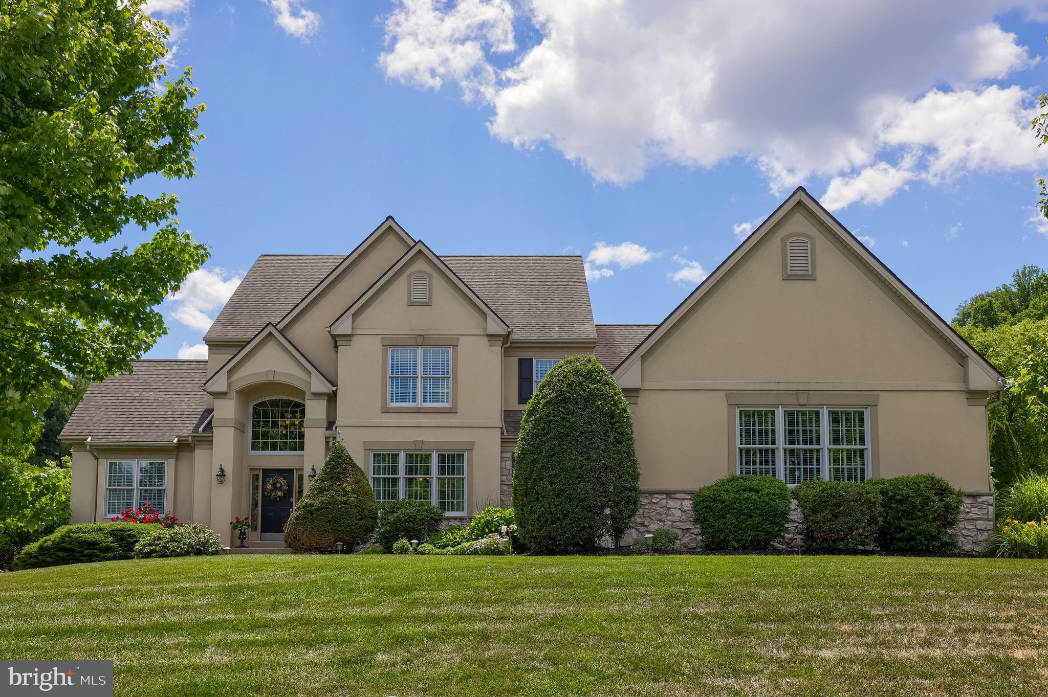 Welcome to 1134 Persimmon Drive, a stunning custom home in the highly sought-after The Meadows neighborhood of East Hempfield Township. Perfectly positioned for modern convenience, this residence offers quick access to major highways, close proximity to multiple healthcare facilities, premier shopping, top-rated schools, delightful restaurants, and scenic parks—all while being just minutes from the vibrant energy of downtown Lancaster City.

Offering over 4,000 square feet of exquisite above-grade living space, this home makes an unforgettable first impression with a grand two-story entry foyer. Flanked by a formal living room with dramatic vaulted ceilings and an elegant formal dining room featuring wainscoting, chair rail, crown moldings, and a sophisticated tray ceiling, the main floor is designed for both effortless entertaining and everyday comfort.

The open-concept heart of the home is a spacious family room bathed in natural light from tall windows that overlook the serene backyard, anchored by a cozy gas fireplace. The chef’s kitchen is a masterpiece of form and function, boasting an abundance of custom cabinetry, expansive granite countertops, a large center island, a breakfast bar, and ample space for a casual dining table. The premium stainless steel appliance package includes a double wall oven and a gas range, catering to every culinary need.

Retreat to the enormous first-floor primary suite, where 9-foot ceilings continue the sense of openness. This sanctuary features a showcase walk-in closet and a spa-like private bathroom with vaulted ceilings, a relaxing whirlpool tub, a tile shower, dual vanities, and abundant natural light. A dedicated home office with a built-in desk and cabinetry provides the ideal work-from-home setup, while a large laundry room with a convenient fold-out ironing board and a half bath complete the main level.

Upstairs, four generously sized bedrooms and two full bathrooms—each with double vanities and combination tub/showers—offer plenty of space for family and guests, with extensive linen closet storage throughout.

The oversized three-car garage provides abundant space for vehicles, outdoor equipment, and sporting goods. The huge unfinished basement offers incredible potential, with under-slab plumbing rough-ins and an extra course of block for increased ceiling height, making it easily finishable for additional living space.

Step outside to your private outdoor oasis, featuring a large stamped concrete patio with a motorized awning for quick shade on sunny days. The impeccably maintained, strategically designed landscaping ensures ultimate privacy, making you feel as though you are relaxing in your own personal park.

This exceptional home truly has it all—schedule your private showing today and experience the best of Lancaster County living.