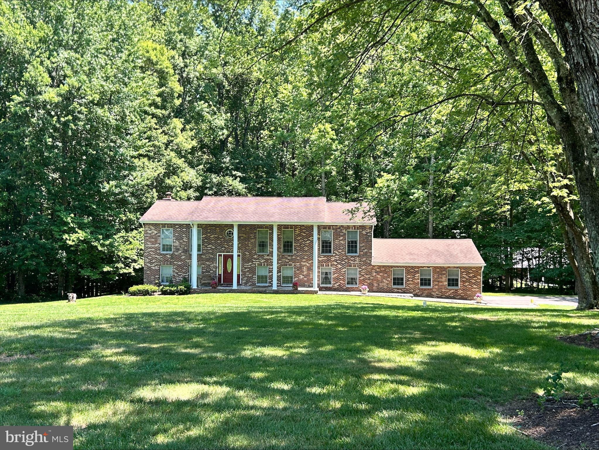 Welcome to your own private retreat! Nestled on 3.71 peaceful acres, this spacious 5-bedroom, 3-bath split foyer is surrounded by nature and framed by six majestic silver maple trees that create a stunning entrance along the driveway. With abundant parking and expansive outdoor space, this property offers the perfect blend of privacy, comfort, and versatility.

Inside, a unique winding staircase serves as the home's centerpiece, connecting two thoughtfully designed living levels. The lower level features a warm and inviting family room with an electric fireplace, a charming brick dry bar (rough-in for water), two bedrooms, a full bath, and a convenient laundry room. Sliding glass doors open to a private patio, while direct access to the attached two-car garage—equipped with remote openers and coded keypads for each bay—adds everyday convenience.

Upstairs, you'll find a bright and welcoming living room, formal dining room, and an eat-in kitchen perfect for gathering with family and friends. The spacious primary suite includes a private bath, walk-in closet, and dedicated vanity area. Two additional bedrooms and another full bath complete the upper level.

A standout feature of this property is the impressive pole barn, offering two additional garage bays, electricity, water service, generous storage, and built-in cabinetry that creates an ideal workspace for hobbies, woodworking, or a home studio.

Whether you're looking for room to spread out, space for projects, or simply a peaceful place to call home, this exceptional property offers endless possibilities. AND you have a Home Warranty - what a relief knowing you're covered for a year!

No sign on property yet.