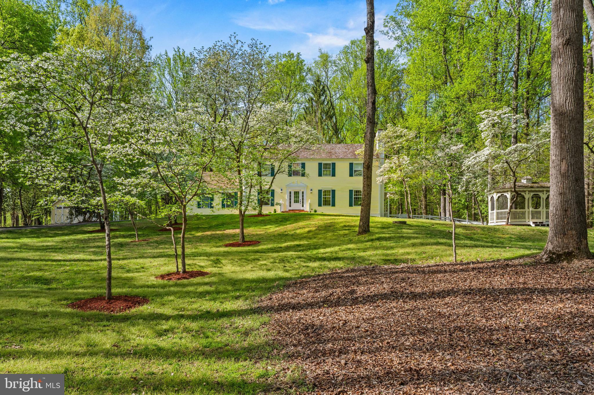 Nestled on 2.38 private, wooded acres in sought-after Great Falls, this beautifully updated 3,645 sq. ft. Colonial home features 5-bedrooms and 3.5 baths and offers the perfect blend of space, comfort, and natural serenity. Ideally located at the end of a quiet cul-de-sac, the home is just minutes from Great Falls Village, Tysons Corner, and within walking distance to the Potomac River. 
The thoughtfully designed layout features four spacious upper-level bedrooms with oversized closets, plus an additional bedroom on the walk-out lower level, ideal for guests or an au pair suite. The expansive finished basement boasts hardwood floors and flexible living space for recreation, work, or fitness. Two wood-burning fireplaces in the home add warmth and charm.
Recent updates provide peace of mind, including a new roof (2026), water filtration system (2025), new HVAC systems (2024), and dual washer/dryer sets on both upper and lower levels for added convenience. The home has been extensively updated in recent years, offering true move-in readiness.
Outdoor living shines with a large deck overlooking an expansive, wooded backyard that is fully fenced, perfect for entertaining or relaxing in total privacy. The property also includes a heated 3-car garage with insulated garage doors, a custom Amish-built shed, screened-in gazebo and storage shed. 
Tucked within Great Falls’ highly desirable River Corridor, this property offers immediate access to the area’s most treasured outdoor amenities. Enjoy a short walk to scenic bridle paths and the expansive natural beauty of River Bend Park.
Located within the Langley High School district, 9201 Potomac Woods Lane presents a compelling opportunity for a private, multi-acre estate in one of Great Falls’ most prestigious settings.