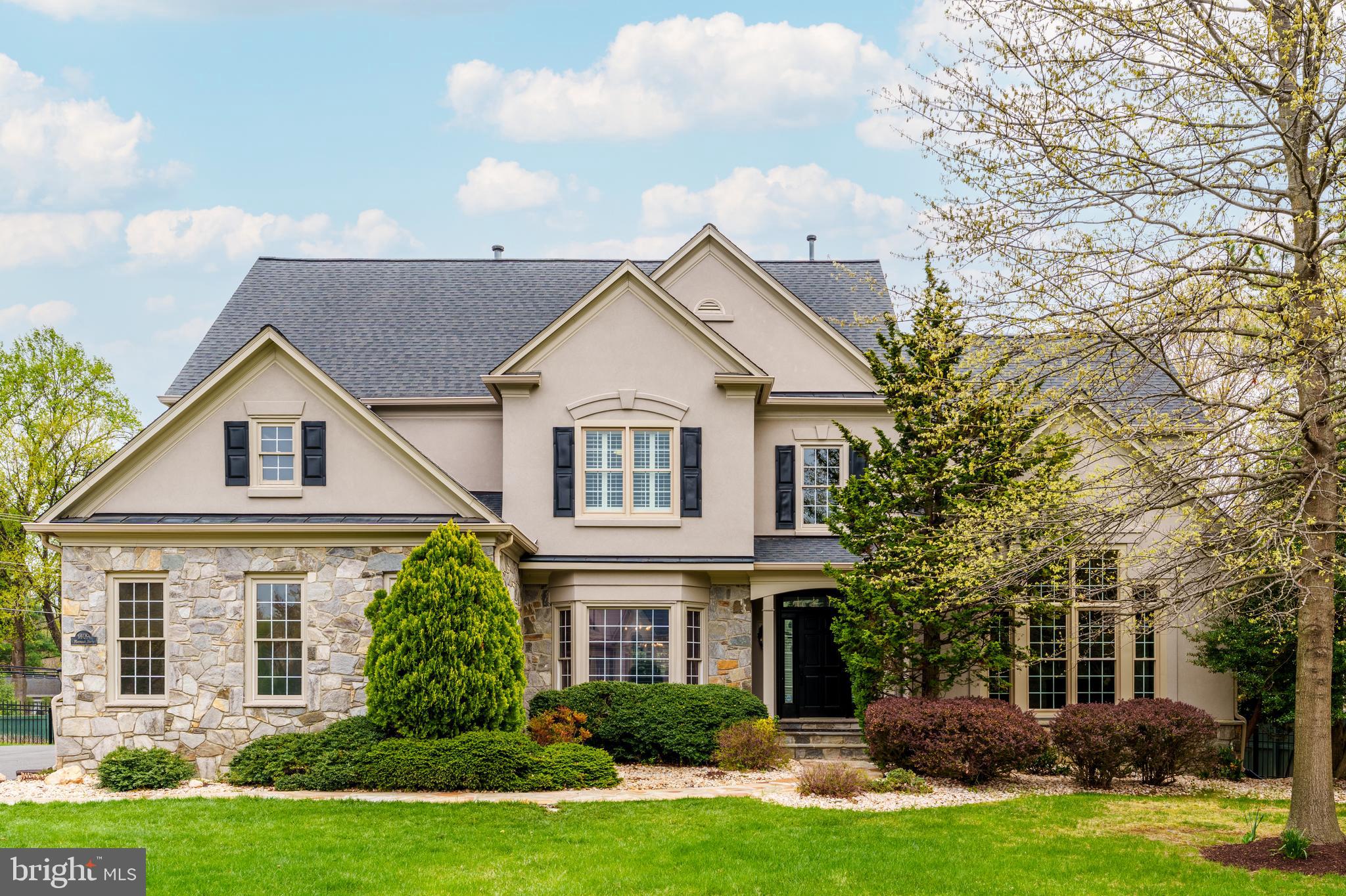 Located in the highly sought-after McLean Hundred neighborhood, this elegant home offers the perfect blend of luxury, comfort, and convenience. With easy access to major commuter routes, Tysons Corner, downtown McLean, and a wealth of shopping and dining options, the location is ideal for modern living within the Langley HS, Cooper MS, and Spring ES school pyramid.

Set on a .62 acre lot on a private street with a spacious front yard, the home’s exterior features a sprinkler system, expansive deck, and beautiful stone paver patio. An attached side-entry three-car garage with soaring ceilings offers ample storage and functionality.

Inside the  7,150 square foot home you will find high ceilings, abundant natural light, crown and chair moldings, and elegant details.  A dramatic two-story foyer with chandelier and hardwood floors sets the tone.  Adjacent to the foyer are a dining room and an oversized office featuring hardwood floors and coffered ceiling. A two-story family room provides hardwood floors, gas fireplace, and doors to the back yard. The gourmet kitchen is complete with granite countertops, a center island, ceramic tile flooring, walk-in pantry, and stainless steel appliances including a double oven, gas cooktop, dishwasher, and built-in microwave.  Adjacent is a charming breakfast/sitting room combination with a vaulted ceiling, fireplace, and built-in desk area.  On the way to the three car garage is a convenient mudroom with a closet and separate laundry room with cabinets and a utility sink.

The spacious main-level primary bedroom includes hardwood floors, tray ceiling, fireplace, and direct access to the rear deck. The en-suite primary bath includes two walk-in closets, a soaking tub, separate shower, and dual vanities. Upstairs you will find four large bedrooms with generous natural light and walk-in closets. Two of the bedrooms feature private en-suite baths, while the remaining share a Jack and Jill bathroom with dual sinks.

The finished lower level offers an expansive recreation room perfect for entertaining, a bonus room with a walk-in closet and direct access to a full bathroom, a dedicated gym with rubber flooring and mirrored walls, and a large storage area.

The home is equipped with two HVAC systems for year-round comfort, and is serviced by natural gas, public water, and public sewer. Every detail of this beautifully maintained property has been thoughtfully designed for comfortable living and gracious entertaining.