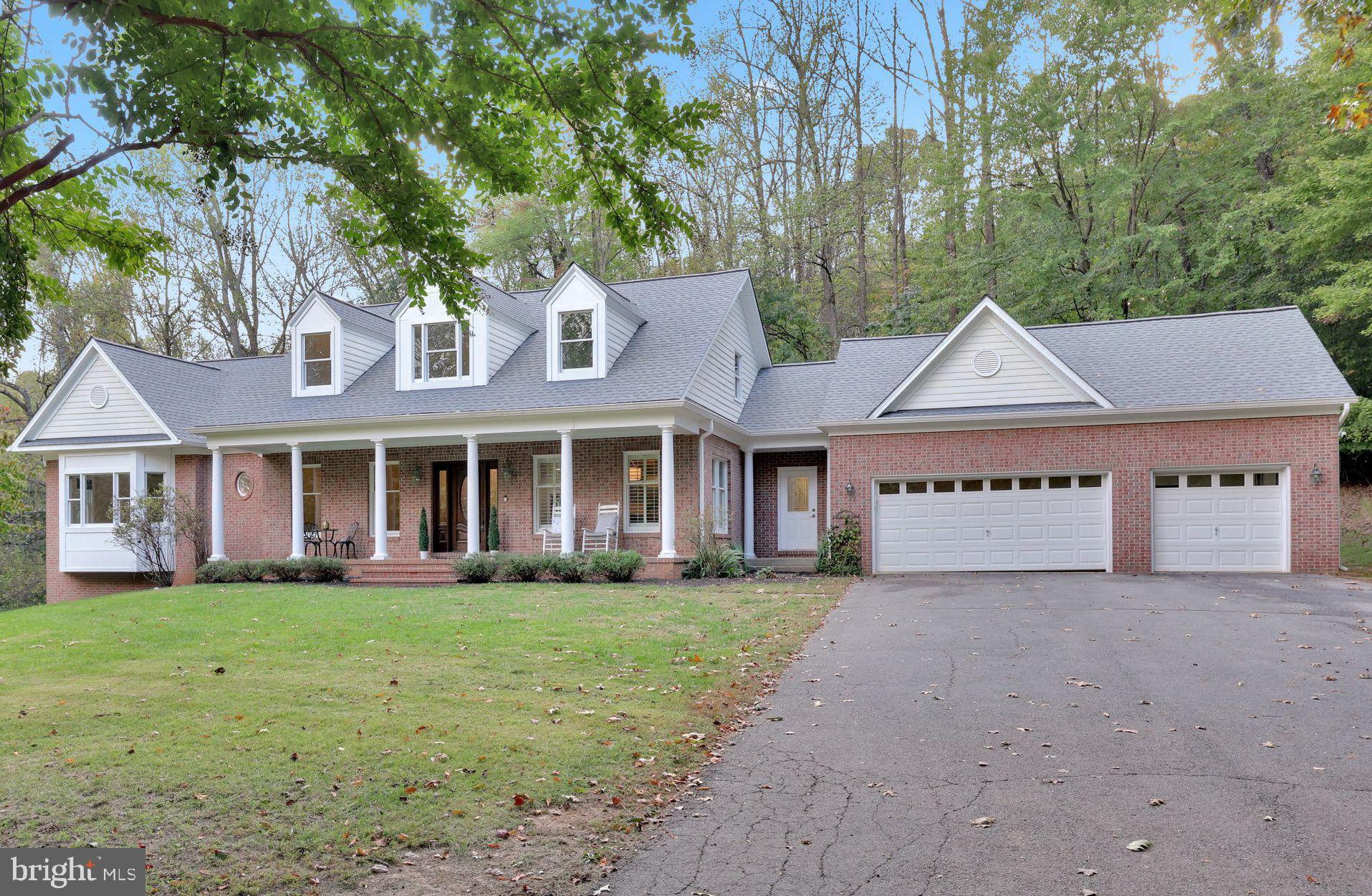 You want seclusion… but you also want to be minutes from all your favorite Leesburg spots? Presenting: BOTH. Set on 25 acres of wooded privacy, yet just minutes from downtown Leesburg, all shopping and restaurants, scenic farms, vineyards, and breweries, this custom Cape Cod estate offers the perfect blend of privacy and accessibility. Designed for both everyday comfort and entertaining - plus multigenerational living, this home almost features too many highlights to list. Highlighted by 6 bedrooms, 6 bathrooms, over 5,600 finished square feet, a full in-law suite, brand-new renovations, and a 3-car attached garage with a detached 4th garage and shed for added flexibility.

As you step inside, you’re met with the open brand-new renovated kitchen, perfect for hosting gatherings and flowing seamlessly to the dining and living spaces. You’ll be smacked in the face with natural light in the four-season sunroom, serving as a peaceful retreat overlooking your private domain.

The main-level primary suite provides vaulted ceilings, dual closets, and a brand-new renovated bathroom oasis straight out of a magazine. The main level and upstairs consists of 5 total large bedrooms, 4 total bathrooms, a bonus room, and multiple living spaces.

The finished basement greatly expands the home’s living space with a full in-law suite, including its own kitchen, living room, bedroom, full bathroom, walk-in closet, 2nd laundry, and private exterior entrance – and this space was completed just two years ago. The lower level boasts a brand-new wet bar with barstool counter and hookups for additional appliances. For added luxury, the lower level features soaring 9-foot ceilings, wiring for 7.1 Dolby Surround Sound, a guest half bath (in addition to the full bath in the in-law suite), a smart dual-zone HVAC system, and newly upgraded water treatment system.

Thoughtful upgrades include a completed renovated kitchen (2025), completely re-built primary bathroom (2025), renovated lower level (2023 and 2025), brand-new UV water softening system (2024), newer roof, and new 6-inch gutters and downspouts, whole-home generator, and more. Zoned AR1, the property offers endless opportunities for customization – bring your animals, build a horse stable, an ADU, the options are endless. You won't find another property in Loudoun County with this much acreage, this close to downtown, and with this many upgrades.

Offering unmatched privacy without sacrificing convenience, this home is a rare opportunity to own a versatile retreat close to historic Leesburg and the best of Northern Virginia wine country.