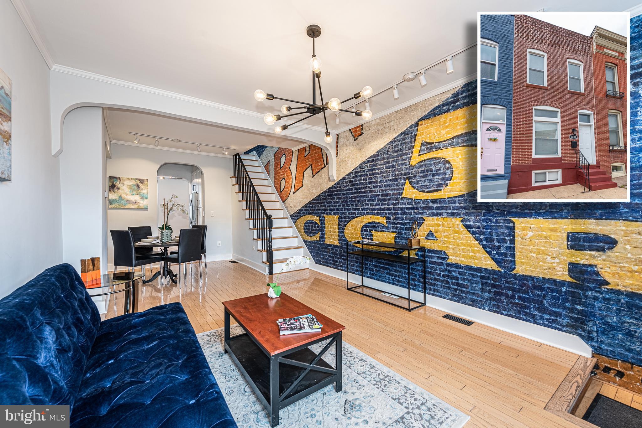 TRULY UNIQUE CANTON ROWHOME WITH 3 FINISHED LEVELS & OVER 1,400 SQ. FT. OF LIVING SPACE!  Features include and open floor plan, spacious living room with gleaming hardwood floors and exposed brick mural (featured in the Baltimore Sun), separate dining area, attractive gourmet kitchen with ss appliances, Quartz counters, and subway tile backsplash, convenient main level half bath, upper level with 2 bedrooms and 1 full bath with a clawfoot tub, finished basement with an expansive family room with built-in media center, and a large unfinished portion for laundry and plenty of storage space, and a rear private paver patio with Pergola.  Located in the heart of Canton and walking distance to Canton Square, dog park, Merritt Athletic Club, Canton Crossing, and tons of neighborhood restaurants.  This is not your typical cookie cutter home - pack your bags and move right in!  Click on View Documents to read the Baltimore Sun article regarding the history of the living room mural!