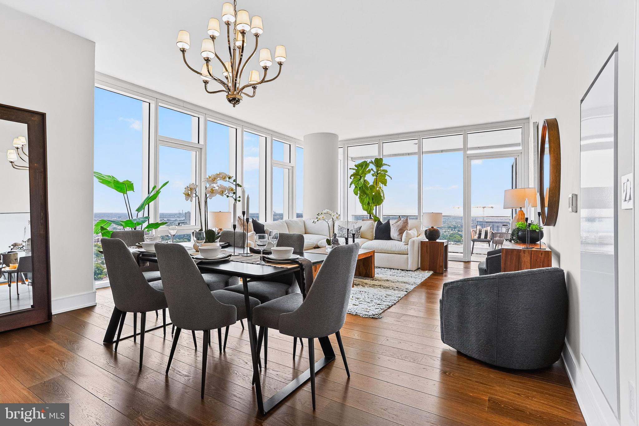 A FULLY FURNISHED, FULLY WOW DECORATED 2BED, 2.5 BATH, 1817 SF single-level residence with Delaware River and southern views priced at $1,590,000! Welcome to Arthaus, a commanding new residential high-rise in Philadelphia’s performing arts district. 

This maintenance-free, move-in-ready corner home offers high-end interior design, resort amenities, white glove services, and the utmost privacy. Tax abatement is available.  Whether you're a busy professional, retiree, or globe trotter, 2302 is a MUST-SEE!

Arthaus impresses you from the moment you arrive. The beautifully grained, solid wood front door swings open to a gracious foyer that's long and spacious, perfect for displaying an art collection. There's also a powder room and coat closet. The entrance meets a hallway to the sleeping wing, where you'll find the laundry area.

Straight ahead is the great room with unobstructed Delaware River and bridge views. Soaring ceilings, floor-to-ceiling windows, wide-plank Havwood flooring in Salvo, and a weather-protected walk-out balcony make the great room feel bright and airy, with plenty of space for entertaining or relaxing with loved ones. Situated on the southeast corner of the building, the views go for miles without a single obstruction making the home feel totally private and tucked into the sky.

The chef’s kitchen is ready for every occasion, with a stylish large center island that seats four. The white and silver ash white cabinets by Poggenpohl add a crisp look that commands attention. Golden Gate Quartz covers the counters and backsplash. The high-end stainless appliance package includes Wolf, Bosch, Sub-Zero, and Asko appliances. The door fronts have been fully integrated into the cabinet design for a seamless, high-end, polished look.

The primary suite and one guest bedroom are on the east side of the condominium, with river and bridge views. The second bedroom has an ensuite bathroom and is a perfect spot for visiting guests. They'll love the east-facing views of NJ. The guest bathroom has a walk-shower tiled in Porcelain Calacatta, a Kohler toilet, and Poggenpohl single sink vanity in polar white matte topped with super white quartz. The elegant owner's suite has a large walk-in closet and a generous sleeping area with river and Jersey views. The best-in-class bathroom package includes a Badeloft soak-in tub, double vanity with Robern mirrors, super white quartz marble and Poggenpohl cabinets, Olympic Sky grey marble floors and shower tile, and a Kohler toilet closet.

Arthaus is a modern masterpiece crafted by renowned developer Carl Dranoff, designed by Kohn Pedersen Fox, and built by Intech Construction. Its architecture and amenities prioritize wellness and well-being, from the stunning Monet-inspired mosaic in the lobby to the private resort on the 6th and 7th floors, featuring a pool, fitness facilities, spa, salon, pet park, outdoor terraces, lawns, gardens, and more. White glove services include a 24-doorman, concierge, chauffeured town car, and valet. 

This home comes with 1 parking license. With the tax abatement, annual real estate taxes are approximately $3,443