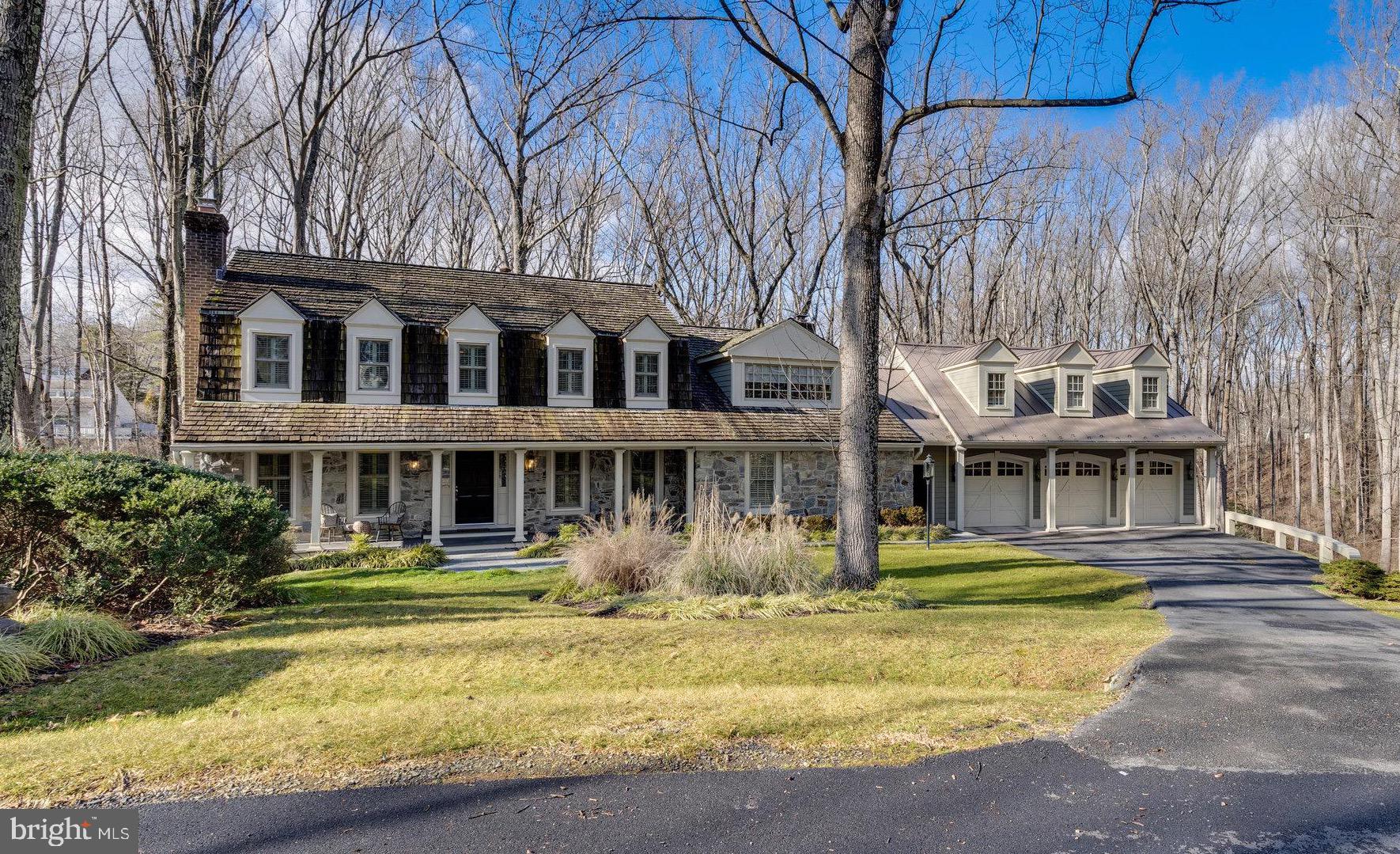 Stunning cottage home featuring 5 bedrooms, 5.5 bathrooms, and 5,200 square feet of living space. Located on a private 2.96 acre lot backing to walking path and trees. This home boasts a sense of refinement with attention to detail in every corner with extensive updates throughout. Formal living and dining rooms and main level office. The gourmet kitchen features large center island, paneled front refrigerator and freezer, upgraded appliances, and breakfast room. Cozy family room with show stopping stone fireplace mantel and access the back screened in patio. rounding out the main level is the half bath, laundry room, and private stairway access the the upper level guest suite. Upstairs is home to a generous owner's suite with sitting room, walk-in closet with custom storage, and spa-like en suite bathroom. Three additional bedrooms and two full bathrooms located on the upper level. In addition to these bedrooms, the upper level features a private guest suite only accessible through the stairway in the mud room or outside. This suite is home to a spacious sitting room, large walk-in closet, and private en suite bathroom. The perfect retreat for out of town guests! The basement features a large recreation area that can be utilized for a multitude of purposes, storage room with a wall of built-ins, and full bathroom. Walk-out level access to the backyard and patio. Relax and unwind on the screened-in porch or deck overlooking the sprawling 2.96 acres. Oversized three car garage and ample driveway parking. Nestled conveniently off of lawyers road yet minutes from downtown Vienna, this home is truly in the perfect location. Minutes from commuter routes, shops, and restaurants.