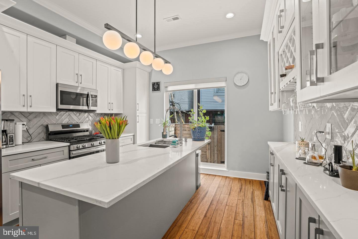 Welcome to 1751 S Taylor Street—new construction (2022) DONE RIGHT: blending modern design with everyday comfort.

Step inside to impeccably maintained hardwood floors, crown molding, and custom millwork that give the space a polished feel. The kitchen is built to impress, featuring a large island, Samsung stainless steel appliances, solid stone countertops, and soft-close Shaker cabinetry—perfect for hosting or enjoying your home while keeping it low-key.

Upstairs, spa-inspired bathrooms showcase porcelain and marble tile, sleek glass enclosures, and freestanding tubs with rainfall showerheads. The primary suite offers a bright bay window and generous closet space—your own retreat.

The rooftop deck seals the deal with 360° views of the Philadelphia skyline—ideal for entertaining or unwinding. Add in SmartHome features, surround sound, a full backyard, and 7 years remaining on the tax abatement: you’ve got both style and smart value.

And the location? You’re right in the middle of it all—grab a beer at Dock Street Brewery, brunch at Café Ynez, or dinner at Chick’s. With tree-lined blocks, a strong neighborhood feel, and easy access to Center City, this pocket of South Philly makes daily living feel effortless.

This is city living done right—don’t sleep on this one.