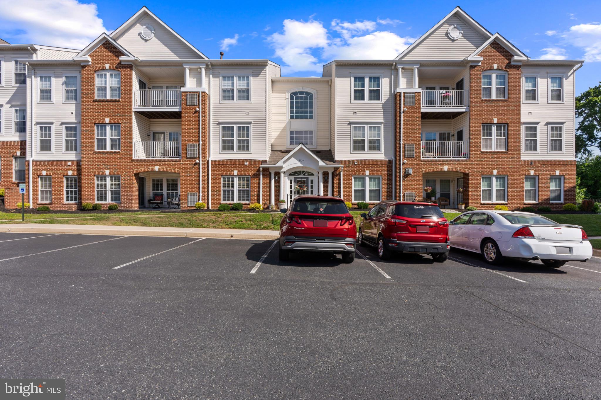 Nestled in the charming Village Green community, this delightful 2-bedroom, 2-bathroom unit offers a perfect blend of comfort and convenience . Built in 2004, the traditional design features an attractive brick and vinyl exterior, inviting you into a well-maintained space that feels like home. Step inside to discover an open floor plan that seamlessly connects the living and dining areas, enhanced by crown moldings and beautiful wood flooring. The country-style kitchen boasts upgraded countertops and stainless  appliances, including a refrigerator, stove, dishwasher, and disposal, making meal prep a joy. The convenience of in-unit laundry with a washer and dryer adds to the ease of daily living. Retreat to the spacious primary bedroom ensuite, with double closets including a walk in closet, ensuite bath with double bowl vanity and walk-in shower. The sun filled den provides flexibility for guests or a home office.  Second bedroom has access to hall full bath for added privacy and convenience. Thoughtful features like an intercom system enhance your comfort and security. Outside, the community offers well-maintained common grounds and your own private patio. With included amenities such as lawn maintenance, snow removal, and trash services, you can spend more time enjoying your home and less on upkeep. This inviting residence is not just a place to live; it's a place to thrive. Experience the warmth and convenience of Village Green living today!