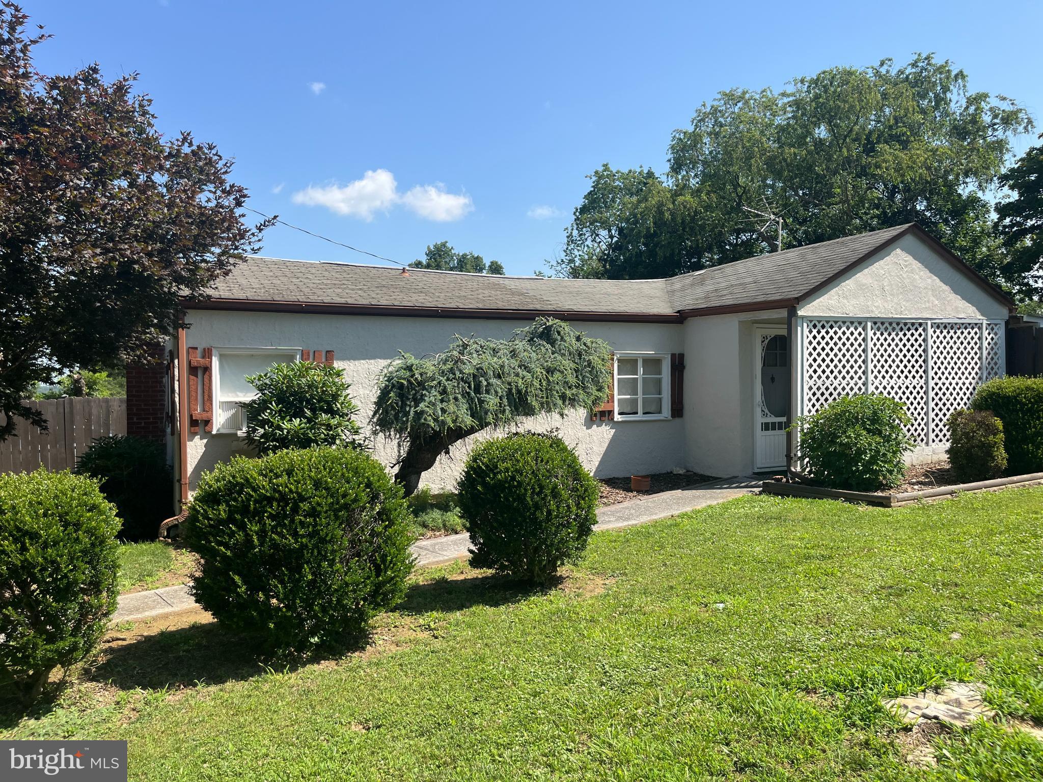 This acre corner lot has two sheds plus a chicken coop!  Generator comes with home.  Basement has washer and dryer which convey.  Double car carport, oil furnace, patio furniture conveys and has new cushions stored in basement. Music room has padded walls for acoustics.  Homes is being sold as is; everything works, roof is 2012. Septic was pumped in October.  Four window units convey as well.   New well pump 2018
