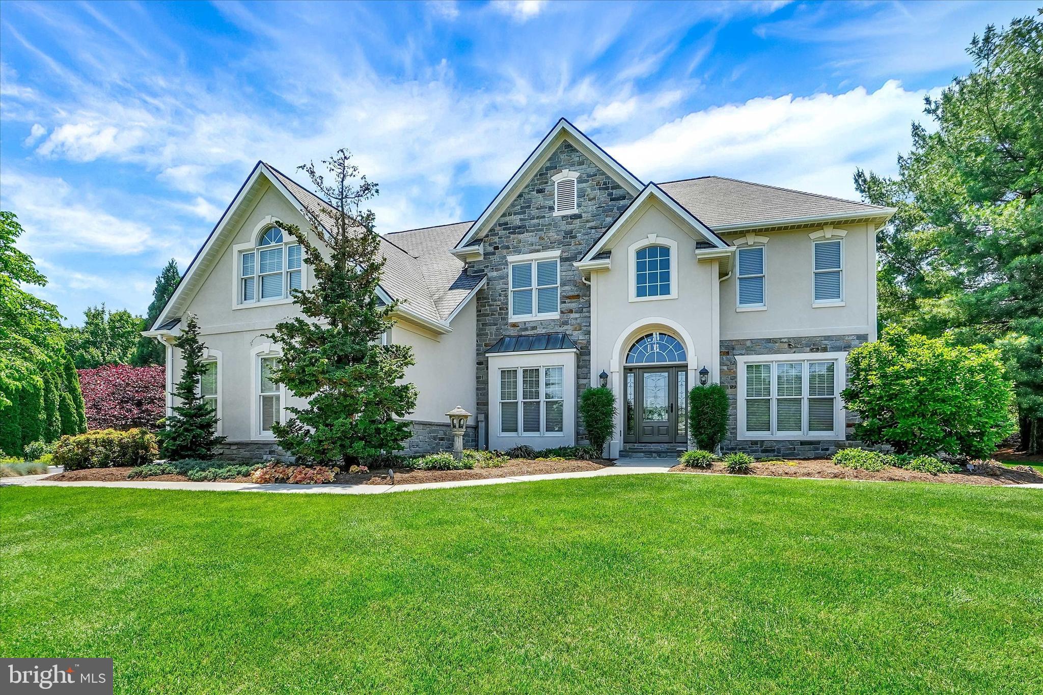 A rare opportunity to call one of York’s most prestigious communities home. This exceptional property offers an unmatched blend of luxury, convenience, and lifestyle in a location prized for its proximity to WellSpan and Apple Hill Medical Complexes, quick access to I-83, the desirable York Suburban School District, and just minutes from The Country Club of York. Designed for those who value sophistication without sacrificing practicality, this is refined living tailored for everyday life. Step inside the grand two-story foyer, beautifully flanked by formal living and dining rooms that create an elegant first impression. The inviting family room, centered around a warm gas fireplace, flows effortlessly into the kitchen and adjoining 4-seasons room, where walls of windows frame peaceful backyard views and create the perfect place to unwind. From here, step into one of the home’s most impressive features, an exceptional covered outdoor living area complete with a stone fireplace and retractable screening system, creating a space equally suited for gatherings or intimate evenings. The newly renovated custom kitchen is a true culinary showpiece crafted for entertaining and everyday living alike. Thoughtful details include expansive quartz surfaces, an oversized center island, illuminated glass cabinetry, custom wine and cookbook storage, and a walk-in pantry. Professional-grade appliances elevate the experience, including an impressive Wolf gas range with custom hood, Wolf steam oven, Fisher-Paykel double drawer dishwasher, galley accessory sink, and Sub-Zero refrigeration. An adjoining breakfast area captures tranquil backyard views and seamlessly connects indoor and outdoor dining spaces. Just off the kitchen, a mudroom connects to the oversized three-car, end-load garage. There is also an office, with direct patio access, on the first floor. Upstairs, the owner’s retreat offers the privacy and comfort expected in a home of this caliber, featuring a sitting room, multiple walk-in closets, and a spa-like bath with whirlpool tub, oversized vanity area, and separate walk-in shower. An open upper-level gathering space anchored by a gas fireplace offers flexibility for a media, study, or game area. Three additional bedrooms, a full bath, and a laundry room complete the second floor. Designed for recreation and relaxation, the partially finished lower level offers exceptional versatility with gathering spaces featuring a wet bar, beverage refrigerator, gas fireplace/stove, and included surround sound system, large-screen TV, and sectional sofa. An additional exercise or hobby room and powder room provide valuable finished living space. The spacious unfinished area offers abundant storage while presenting endless future expansion possibilities for recreation space, a home theater, additional bedrooms, or other customized living areas. Outside, beautifully manicured grounds create a private outdoor sanctuary enhanced by mature landscaping, colorful gardens, walkways, a tranquil ornamental pond, pergola, and multiple gathering spaces designed for relaxation, entertaining, or viewing sunsets. Retractable awnings spanning the rear of the home further enhance outdoor living opportunities. The expansive yard provides ample room for future enhancements.....envision a custom pool, with outdoor kitchen, to create your own private backyard retreat. Completing the outdoor experience is a luxury detached outbuilding featuring French doors, windows, electric, water, and a covered front porch perfectly suited for your future upscale pool house, a garden house, creative studio, wellness area, or additional flex space. There is also a whole house generator on the property. From its beautifully designed interior spaces to its exceptional outdoor amenities and premier location, this distinguished property delivers an experience few homes can offer—creating an opportunity as remarkable as the home itself.  AGENTS - Please read Agent Remarks.