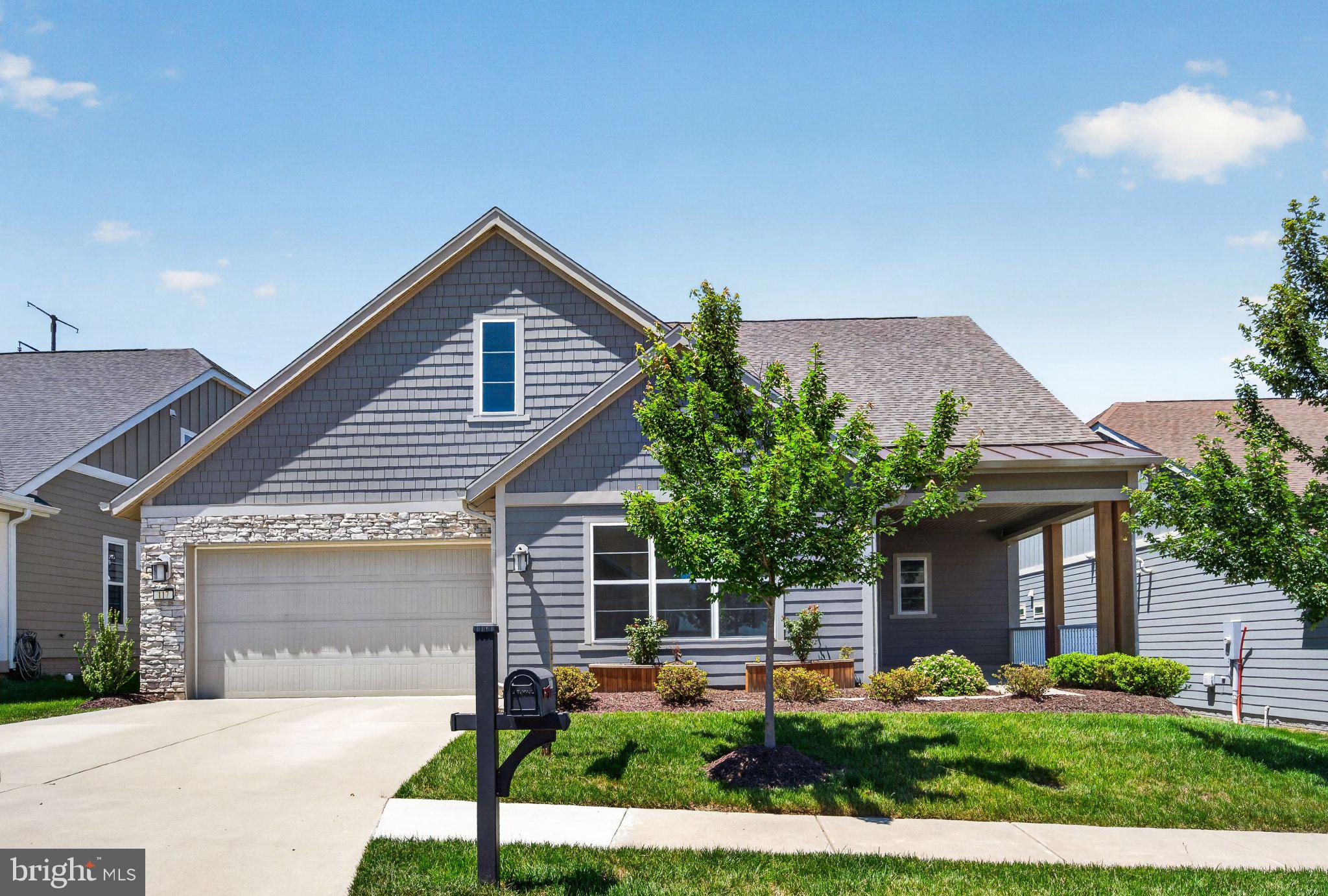 Located in the gated, amenity-rich Trilogy at Lake Frederick active adult community, this home offers comfortable, low-maintenance living with peaceful, tree-lined views. Open-concept spaces are ideal for both everyday living and entertaining, with a seamless flow from kitchen to living area and a cozy fireplace for added warmth.
Enjoy outdoor living with covered front and rear porches plus a patio—perfect for relaxing or hosting. Community amenities include pools, a fitness center, tennis courts, walking trails, an art studio, and a restaurant. Conveniently located on the clubhouse side of the community, this home combines lifestyle, comfort, and convenience.

Floorplan available in photos.