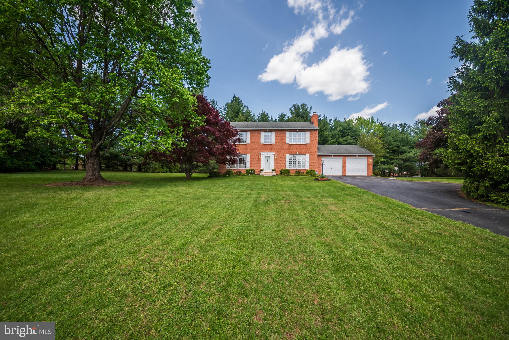 Charming home built by original owners located at the end of a very peaceful cul-de-sac.  Backing to trees, the acre plus pie shaped lot has ample room for a future in-ground pool if desired.  Brick front, classic center hall Colonial boasts large living room, separate formal dining room flanked by a den/study with wood burning fireplace, all with original hardwood flooring.  Updated kitchen with white cabinetry to include a large pantry cabinet and corner lighted display cabinet; quartz counters and energy forward white appliances.  Breakfast counter and table space, ceramic tile flooring throughout; main level laundry room with storage and stainless laundry tub.  Thoughtfully designed kitchen opens to den and magnificent sun/great room for your family gathering with separate HVAC control. Generous dining and entertainment space, opens to the patio and side yard.  Upper-level reveals renovated baths.  Primary bedroom with sitting area, large walk-in closet and second storage closet, ensuite bath with separate vanity.  Three additional bedrooms, plus large hall bath with private tub/shower toilet and separate pedestal basin/cabinetry.  The lower level is partially finished with access to rear walk-up stair; ample storage with shelving and utility service area.  Brand new compression tank with transferable warranty and water conditioner recently serviced.  Conveniently located between Rt. 32 and Rt. 97 for easy access to commuting routes.  So close to Glenelg High School you can hear the award winning marching band during football season!  Minutes to Western Regional Park, Glenwood Library and senior center, Circle-D Tennis Club, plus a variety of restaurants and services nearby.  Welcome Home!!