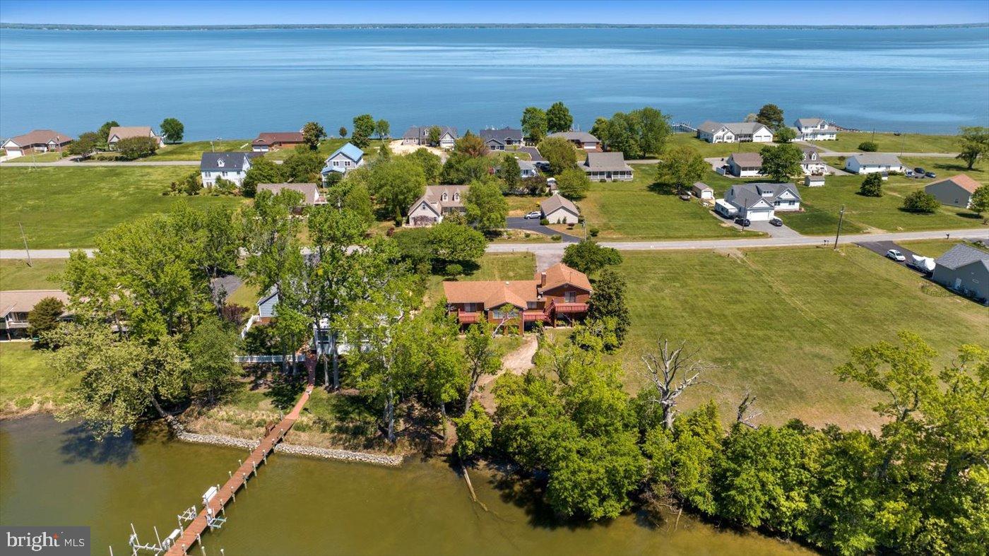 Wake up overlooking protected waterfront on Virginia’s Northern Neck in this private retreat offering over 4,000 square feet, deep water access, multiple entertaining decks, and room for family gatherings, vacation rental potential, or full-time coastal living — all just a couple hours from DC!
120 feet frontage
Protected side of peninsula
Possible extra adjacent lot available
Boat access
Swimming
Fishing
Private access
Stunning Custom-Built Waterfront Home – Recently Renovated on One of the Largest Lots in Cabin Point!   Welcome to your dream waterfront retreat! This nearly 4,000-square-foot, custom-built, all-brick, split-level home has been beautifully updated to enhance both style and functionality. Key Features & Recent Updates: Expansive Living Space: With almost 4,000 square feet of thoughtfully designed space, this home offers plenty of room for relaxation and entertainment. Huge bedrooms, two of which feature new sliding doors with decks overlooking the water. Custom Milled Oak Floors: Elegant custom-milled oak floors run throughout the upper living spaces, adding warmth and sophistication. Two Fully Equipped Kitchens: Both featuring brand-new stainless steel appliances, these kitchens are perfect for hosting large gatherings or accommodating multiple families. Fresh Modern Touches: Vinyl wrapping added to windows, updated lighting fixtures, and fresh paint throughout, giving the home a bright and contemporary feel. Seamless Indoor-Outdoor Living: New sliding doors with screens in the extra large bedrooms invite in the refreshing waterfront breeze, while the expansive, newly redone decks off the living room and bedrooms offer the perfect space to take in the gorgeous water views. Driveway recently repaved. Enhanced Garage: The heated and cooled garage now boasts a durable epoxy floor for added style and functionality. Flexible Layout: Originally designed as a 5-bedroom home, the adaptable layout can be easily customized to fit your needs.   Seller willing to make additional changes as a condition of sale.   Waterfront Bliss: Situated on one of the largest lots in the community, this home offers breathtaking waterfront views and a serene, private setting.   Cabin point has everything you need to enjoy the waterfront life.  From boat ramps to pools and beaches, an amazing summer awaits.  Whether you're looking for a tranquil escape or an investment property with exceptional rental potential, this home is move-in ready and designed to impress. Don't miss out on this rare opportunity—schedule your private showing today.  Seller will consider selling additional .6 acre waterfront lot next door for the right offer!  Your chance to have over 250 feet of sought after waterfront on the protected side of the peninsula!