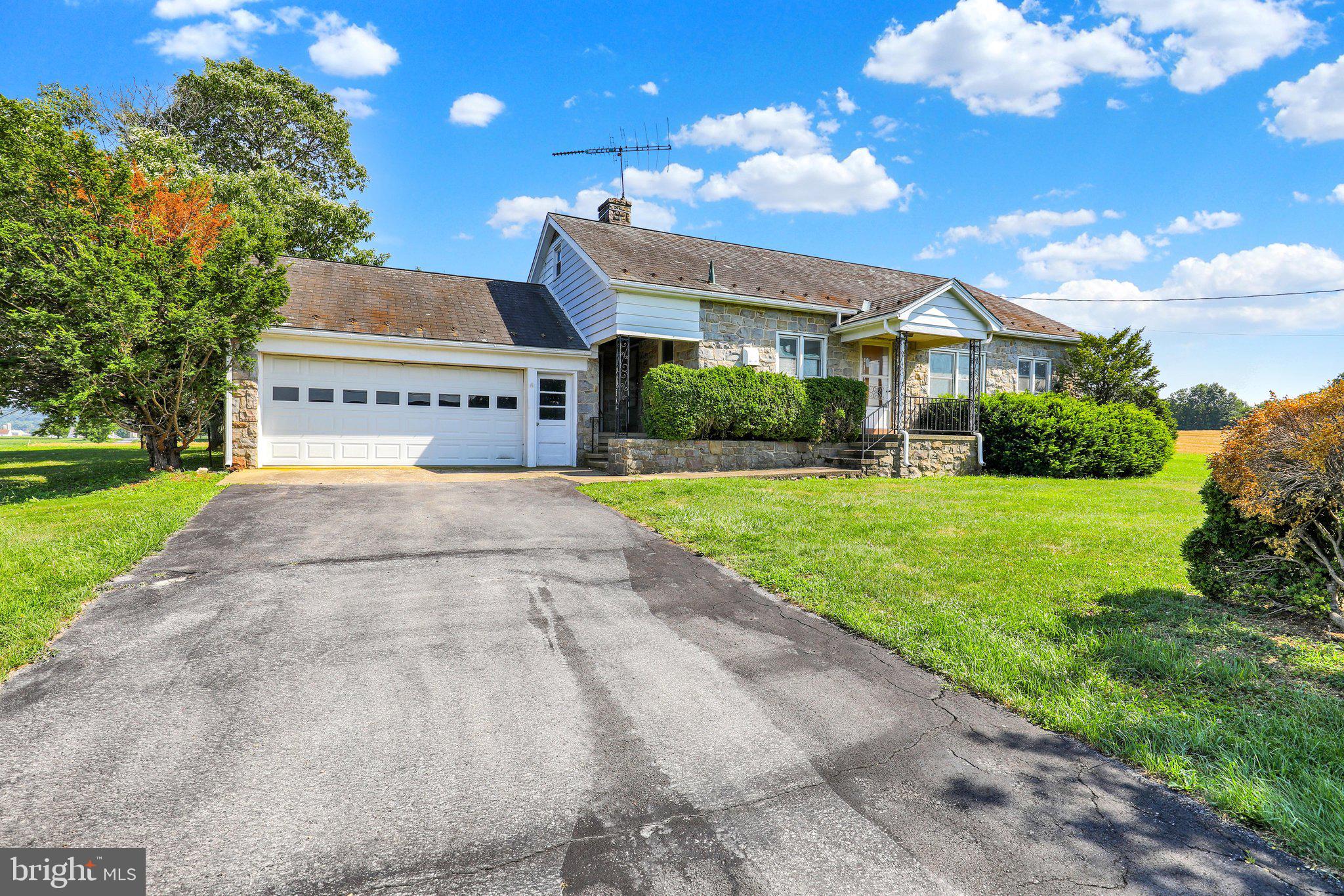 Enjoy the ease of one-floor living in this solid three-bedroom stone ranch home, ideally situated on a spacious lot of just under one acre. Located in Fleetwood Area Schools. Offering great potential, this home is ready for your personal touches and updates to make it your own. The main level features a comfortable living room, a large eat-in kitchen with ample cabinet and counter space, three nice sized bedrooms with plenty of closet space, and a full tile bath. Just off the kitchen is a convenient breezeway with laundry hookups that also provides access to the attached two-car garage. The full unfinished basement offers abundant storage space, while the unfinished attic presents an excellent opportunity to expand the home’s living area in the future. Outside, you’ll appreciate the oversized lot, attached two-car garage, and spacious driveway providing ample off-street parking. Whether you’re a first-time buyer, downsizing, or looking for a home with room to grow, this property offers endless possibilities. Being sold in as-is condition.