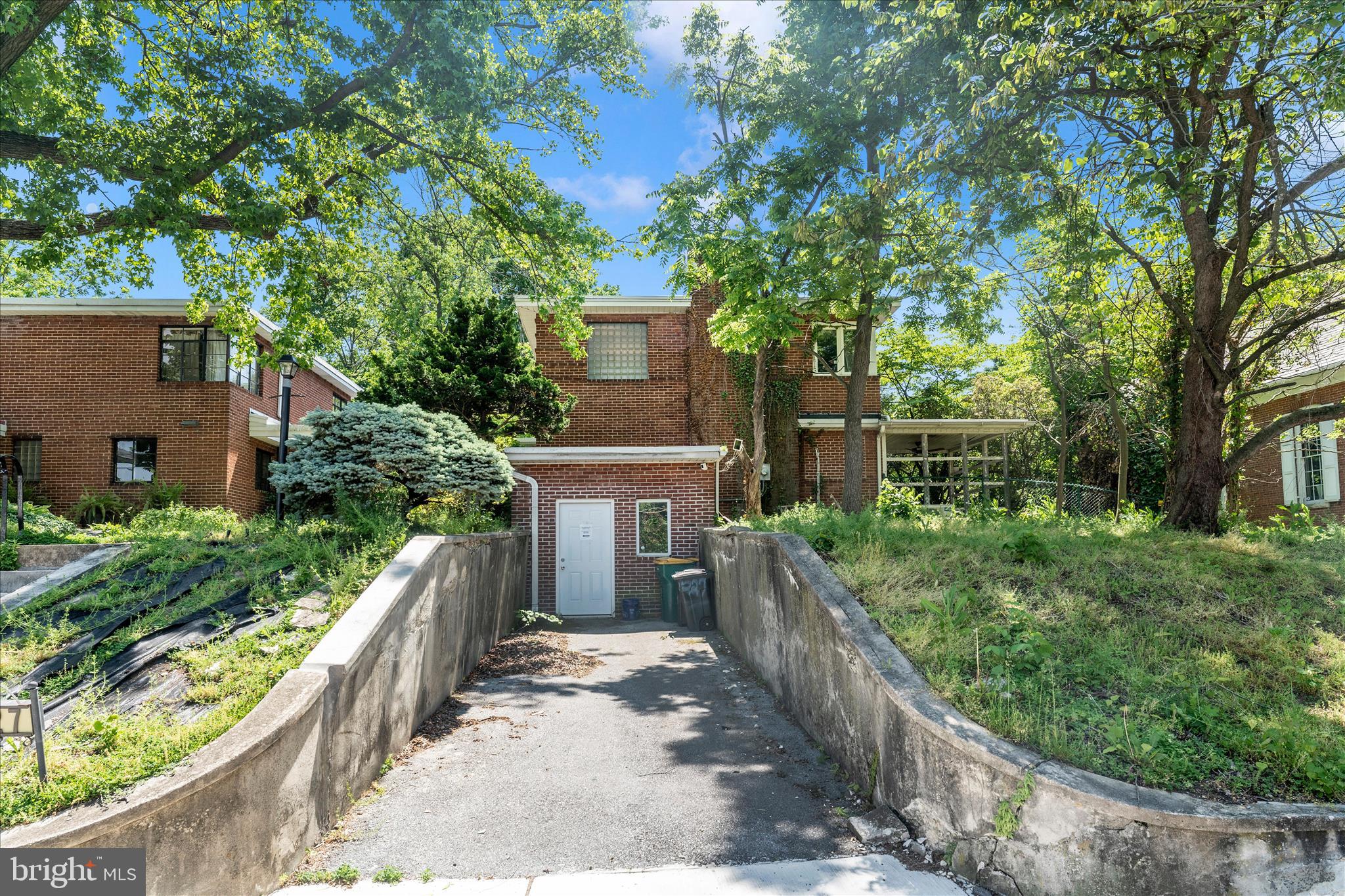 Packed with character and set on an incredible oversized lot, this all-brick home is ready for its next chapter. Original hardwood floors, spacious rooms, unique architectural details, built-ins, and a beautiful backyard setting provide the perfect foundation for renovation or personalization.

The property offers rare privacy, mature trees, garden space, stone patio areas, and an expansive yard that creates a secluded retreat-like atmosphere. With strong bones and timeless features throughout, this home is ideal for buyers looking to restore, modernize, or create a truly special one-of-a-kind property.

Opportunities like this don’t come around often.