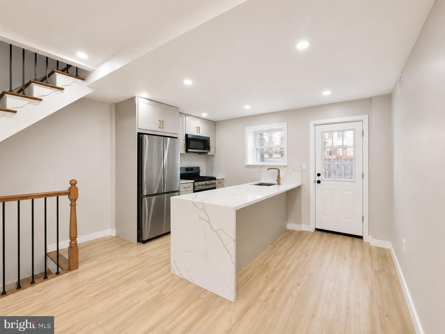 Welcome to 2251 S Hicks Street, a beautifully reimagined home in the heart of South Philadelphia. This property has undergone a complete gut renovation, offering the perfect combination of modern style, quality craftsmanship, and peace of mind. Virtually everything is brand new—from the framing, systems, plumbing, HVAC, roof, windows, kitchen, bathrooms, flooring, and finishes to the electrical and mechanical components.

The first floor features a bright open-concept layout, ideal for everyday living and entertaining. The stunning kitchen boasts quartz countertops, stainless steel appliances, stylish cabinetry, and a large center island with seating.

Upstairs, you'll find two spacious bedrooms and two full bathrooms, including a beautifully appointed primary suite. Thoughtfully selected finishes, modern fixtures, and designer tile work create a clean, contemporary feel throughout.

The clean, dry basement offers additional storage space and includes a half bathroom and a dedicated laundry area, providing added convenience.

This renovation was completed with city permits, and all required inspections have been completed except for the final electrical inspection, which is scheduled to be completed prior to settlement.

Conveniently located just minutes from East Passyunk Avenue, Center City, parks, shopping, restaurants, public transportation, and major highways, this move-in-ready home offers the best of modern living in one of Philadelphia's most desirable neighborhoods.

Don't miss your opportunity to own a like-new home without the new construction price tag!