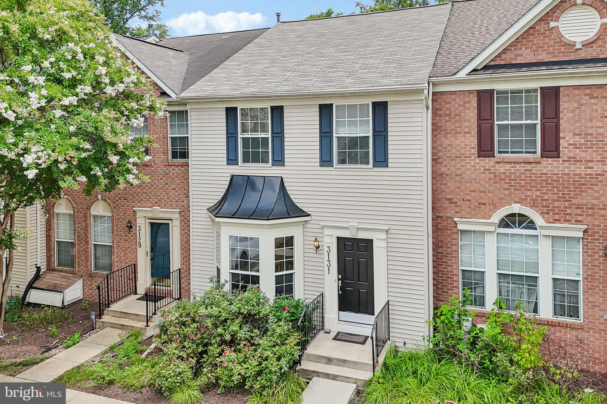 Have you been searching for a home that is TRULY MOVE-IN READY?  Here is the ONE you have been waiting for!  MUCH LARGER THAN IT LOOKS!  Thanks to the THREE-LEVEL BUILDER BUMP-OUT, this exceptional townhome offers 2,700 square feet of beautifully finished living space with 4 bedrooms, 3.5 baths, and a FULLY FINISHED walk-out lower level; all offering more space than some single family homes!!  BACKING TO MATURE WOODS and featuring a FENCED BACKYARD with a paver patio, you'll enjoy a rare combination of space, privacy, and outdoor living.  Even better, this home is truly move-in ready with a BRAND NEW ROOF (June 2026), FRESH PAINT throughout (July 2026), and heating and air conditioning approximately eight years old.  The bright and inviting main level is designed for both comfortable everyday living and entertaining.  The MODERN KITCHEN features stainless steel appliances, including a brand-new range and range hood, an island with breakfast bar, and an adjoining dining area that flows into a sunny morning room. Step outside to the spacious wraparound deck, recently updated with low-maintenance composite materials, where you can enjoy morning coffee, weekend cookouts, or simply relax while overlooking the peaceful wooded backdrop.  The spacious great room is filled with natural light and showcases GLEAMING HARDWOOD FLOORING and a bay window.  Upstairs, the ENORMOUS PRIMARY SUITE is a true retreat, complete with a vaulted ceiling, ceiling fan, and TWO walk-in closets.  The BEAUTIFULLY REMODELED en-suite bath is straight from a magazine, featuring a dual-sink quartz vanity, freestanding soaking tub, ceramic tile flooring, frameless glass shower enclosure with custom tile surround, and designer finishes throughout.  Two additional generously sized bedrooms share the updated hall bath with modern vanity.  The FULLY FINISHED WALK-OUT lower level offers exceptional flexibility with a massive recreation room, a bonus room perfect for a fourth bedroom, home office, fitness room, or hobby space, a full bath, and a generous storage room.  Walk directly out to the paver patio and fully fenced backyard.  Complete with TWO ASSIGNED PARKING SPACES directly in front of the home, this beautifully updated residence offers the space, style, and location today's buyers have been waiting for.  Russett residents enjoy an active homeowners’ association with outstanding amenities, including multiple swimming pools, tennis and pickleball courts, bike, jog, and walking paths, volleyball and basketball courts, picnic areas, tot lots, and so much more.  The highly regarded and tremendously desirable Russett community is strategically located between Baltimore and Washington, DC, offering exceptional convenience. Just minutes from Fort Meade, NSA, APL, major commuter routes, the Laurel MARC–Camden Line train station, shopping, dining, historic Laurel, and BWI Airport.  All IT'S ALL HERE WAITING FOR YOU!  All information deemed accurate but not guaranteed.