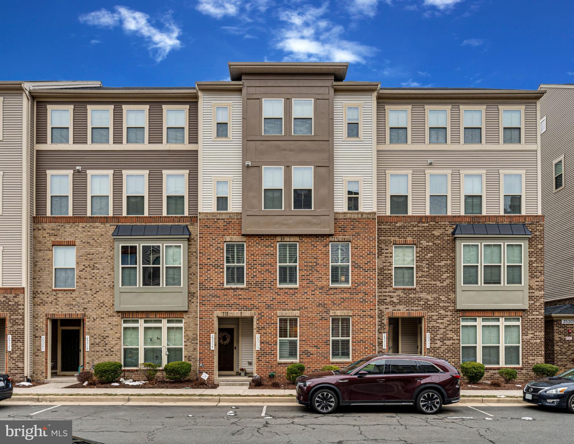 Welcome to 25315 Trumpet Vine Terrace!

This is a first-time offering from the original owners in the sought-after Loudoun Crossing community in Aldie, VA. Here, you'll enjoy a vibrant neighborhood with scenic walking trails, tot lots, tennis courts, and nearby parks—all while having access to a clubhouse with a fitness center and a sparkling community pool.

This piggyback-style condo townhome is part of the highly desirable Pinebrook Elementary, Willard Middle, and Lightridge High School district.  This excellent location is convenient to shopping centers in Stone Ridge, South Riding, and the Dulles Landing Shopping Center.  13 miles to Dulles Airport and 10 miles to Ashburn Station Metro Stop

Garage & Parking
This home features a one-car garage with a driveway that accommodates an additional vehicle. The driveway also offers a bit of extra space, though it's not quite long enough for two cars. Additionally, there is ample free street parking in front of the home, providing convenient options for guests or extra vehicles.

Inside the Home
Upon entry, you're welcomed by a cozy yet open family room and dining area with seamless views into the well-appointed kitchen. The carefully maintained stainless steel appliances, gas cooking, and ample counter space make this kitchen perfect for cooking and entertaining. The rich chocolate espresso-colored engineered hardwood flooring throughout the main level adds warmth and elegance.

A conveniently placed powder room is tucked away from the kitchen but easily accessible for guests. The large pantry provides generous storage, and the direct entry from the one-car garage into the kitchen makes unloading groceries effortless.

Spacious Second Level
Upstairs, you'll find three spacious bedrooms, including an extra-large primary suite that easily fits a king-size bed, dressers, and even a cozy sitting area or small desk. The suite features two walk-in closets and a luxurious en-suite bathroom with a Roman dual-head shower with built-in seating, a large double vanity, and elegant bronze fixtures.

The laundry room is conveniently located on the bedroom level, complete with built-in cabinetry and a sink for easy spot cleaning.

Bedrooms 2 & 3 are larger than typical townhome bedrooms, offering ample space and generous closets. Bedroom 3 even includes a private balcony—perfect for enjoying fresh air and a morning coffee.

The second full bathroom has been recently renovated, featuring a modern enclosed shower—no need to step over a tub!

Throughout the upper level, you'll find plush, top-line carpeting with extra underlayment for comfort, while tile flooring enhances durability in the full bathrooms.

Don’t Miss This Opportunity!
With its thoughtful layout, premium features, ample parking, and unbeatable location, this home is a rare find in Loudoun Crossing. Schedule a showing today before it’s gone!