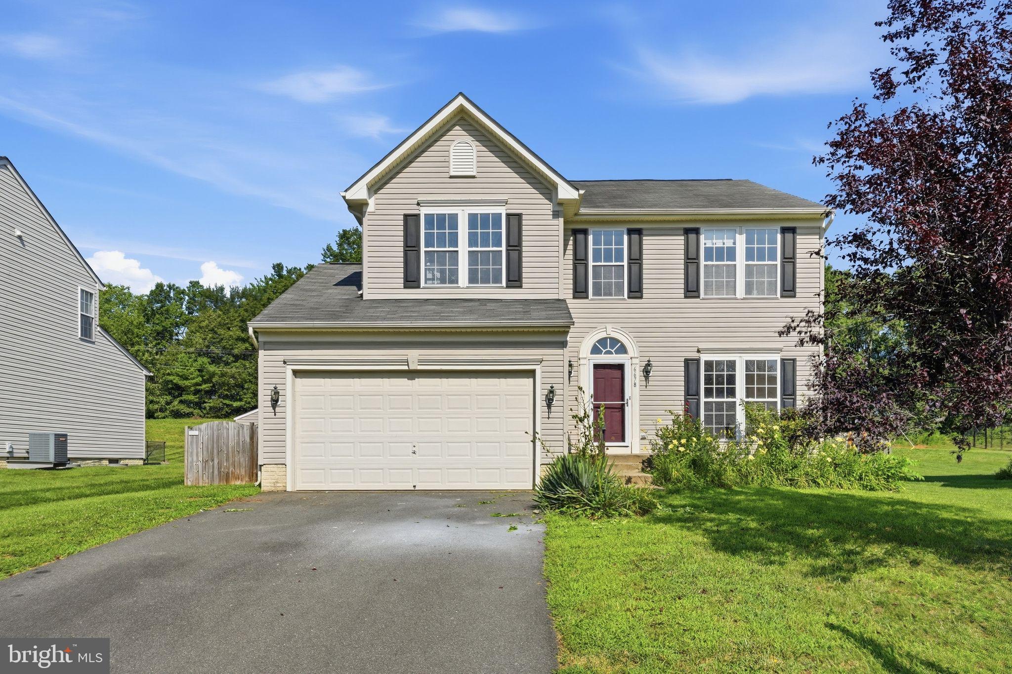 Nestled in the serene community of Green Meadows, this exquisite Colonial-style residence offers a harmonious blend of elegance and comfort. Built in 2006, this home spans an impressive 3,575 square feet, providing ample space for both relaxation and entertainment. Step inside to discover a thoughtfully designed open floor plan that seamlessly connects the family room to the dining area, creating an inviting atmosphere perfect for gatherings. Crown moldings adorn the ceilings, adding a touch of sophistication to the living spaces. The family room, complete with a cozy fireplace, serves as the heart of the home, where warmth and comfort abound during chilly evenings. The primary suite is a true retreat, featuring an en-suite bath that promises a spa-like experience, complete with luxurious finishes and ample space for relaxation. With four spacious bedrooms and three and a half bathrooms, this home accommodates both privacy and convenience. The fully finished basement offers additional living space, perfect for a home theater, gym, or play area, ensuring that every member of the household has their own sanctuary. The exterior of the home is equally impressive, featuring low-maintenance vinyl siding and an attached two-car garage with a front entry, providing both functionality and curb appeal. The asphalt driveway adds to the overall charm, making it easy to welcome guests. Situated on a generous 0.23-acre lot, the property offers a peaceful retreat from the hustle and bustle of daily life. The expansive yard provides endless possibilities for outdoor activities, gardening, or simply enjoying the fresh air. This residence is not just a house; it's a lifestyle. Experience the perfect blend of luxury and comfort in a community that values tranquility and connection. With its high-end features and thoughtful design, this home is ready to embrace its new owners and create lasting memories.