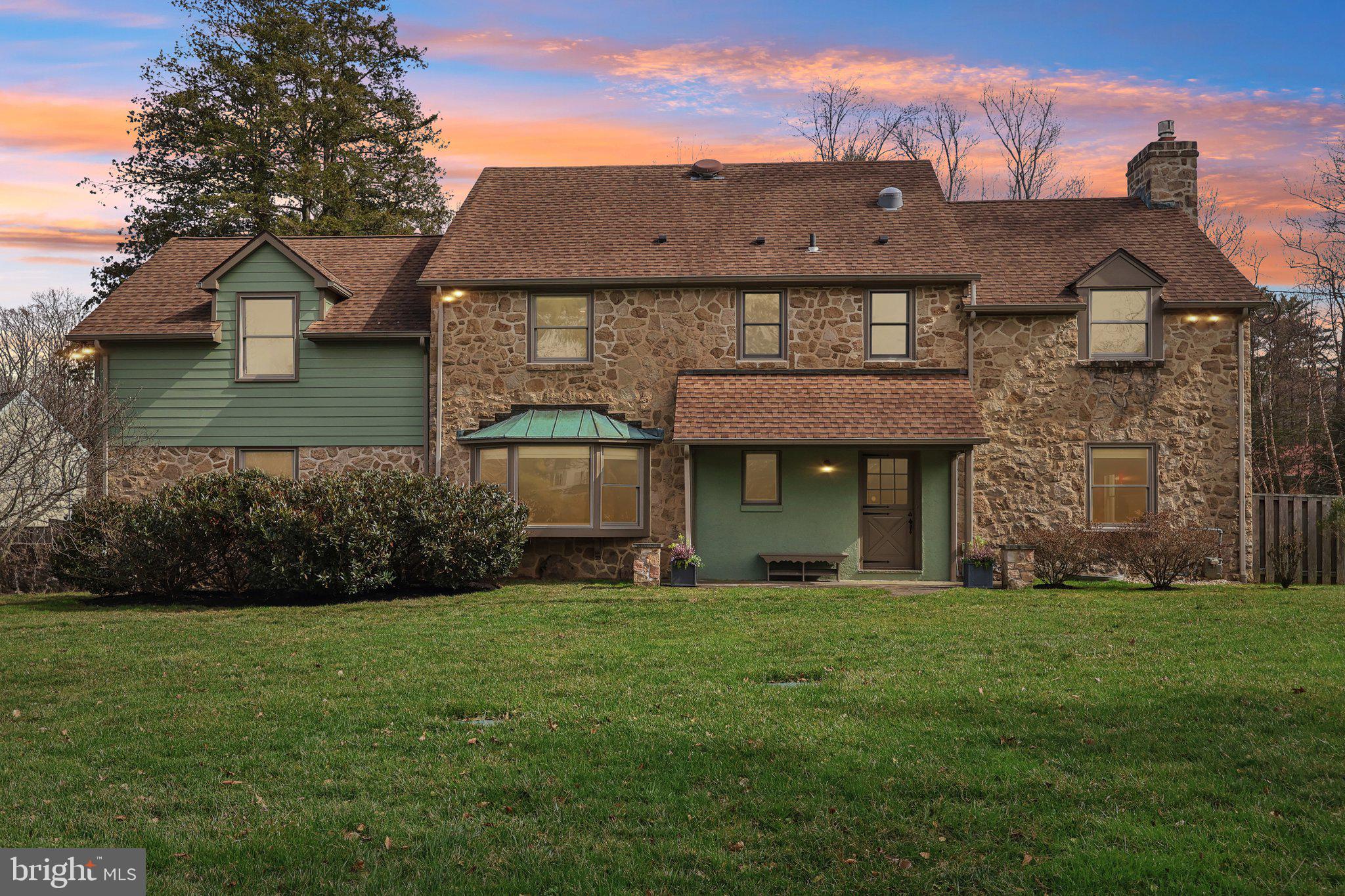 Don't miss your chance to own this immaculately maintained, colonial estate situated on almost an acre of land on a quiet street in Whitpain Township and Wissahickon School District. Walking distance to the Wissahickon Trail System, and only a few miles from downtown Ambler, the Ambler Train Station and the PA Turnpike. This house blends the coziness of a farmhouse feel, including hardwood floors throughout, with modern additions, such as paid off solar panels. You will feel at home the moment you enter the gated driveway and park in the large garage. 
Entering through the front dutch door, you are greeted with a calming mural of the Mediterranean. To your right is the warm, relaxing living room with a working gas fireplace. Down to your left is a powder room next to the office with built-in bookshelves, built-in safe, and a large bow window overlooking peaceful greenery. Continue along past the office into the dining room with french doors overlooking the large yard and back patio with natural gas connections for the grill or heaters. On one side of the dining room is the updated kitchen with connecting mudroom to the driveway. On the other side is the spacious sunroom, added in 2014, with picture rails and access to the fenced side yard. Upstairs you will find 4 bedrooms including the primary bedroom with a walk-in closet and private full bathroom. Past the upstairs washer/ dryer hookup you will find the extra-large addition added over the garage in 2014 that could be used as a bedroom or a yoga/ pilates studio, painting studio, or whatever hobby needs more space. The basement has the washer/dryer, plenty of storage, as well as the home theater room waiting for you to be entertained. You will be enjoying a relaxing summer by the solar heated pool while you do not need to worry about the first year's maintenance, as the owners have paid for this year's pool opening and closing as well as maintenance visits. Situated just past the pool is a large pool house that can also be used as an in-law suite with bathroom, bedroom, small kitchenette, and views of the pool and lush yard. Book your showing now as this property will not last long.