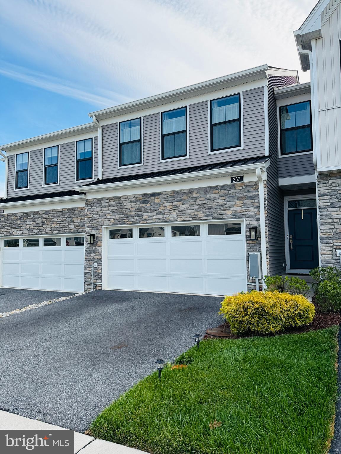 Welcome to 257 Junction Road, nestled in the sought-after Franklin Station community in the heart of Media, PA. This stunning home offers 3 bedrooms, 2.5 baths, and 2,048 sq ft of thoughtfully designed living space — one of the largest floor plans in the community. 
From the moment you step inside, the attention to detail sets this home apart. The owners have elevated the already-beautiful builder finishes with custom picture moldings throughout, designer paint colors, curated hardware upgrades, and a showstopping built-in bar and bookcase in the dining area — perfect for entertaining and everyday living alike. Maintained as a no-shoes household, every surface has been kept in truly pristine condition, making this home feel as fresh as the day it was built. Soaring 9+ foot ceilings and rich hardwood floors flow through the main level, leading to a spacious great room and a chef's kitchen featuring a large center island with breakfast bar, granite countertops, gas cooking, and direct access to a large outdoor deck — ideal for morning coffee, al fresco dining, or simply unwinding at the end of the day.
Upstairs, the generous primary suite impresses with an oversized walk-in closet and a spa-like bath showcasing gorgeous tile work, a dual-sink vanity, and an expanded shower. Two additional bedrooms and convenient upper-floor laundry complete the second level. An attached 2-car garage adds everyday convenience, and the large unfinished basement — with its impressive ceiling height — offers a rare blank canvas ready to be transformed into the recreation room, home gym, or additional living space you've always envisioned.
Community amenities include a clubhouse with fitness center, outdoor pool, and fire pit — all covered under the HOA along with lawn care, snow removal, and trash. Located within the award-winning Rose Tree Media School District (Glenwood Elementary, Springton Lake Middle, Penncrest High), with easy access to the Septa Wawa Train Station just steps away.
Low-maintenance luxury living at its finest — don't miss this one as homes in this neighborhood go quickly!