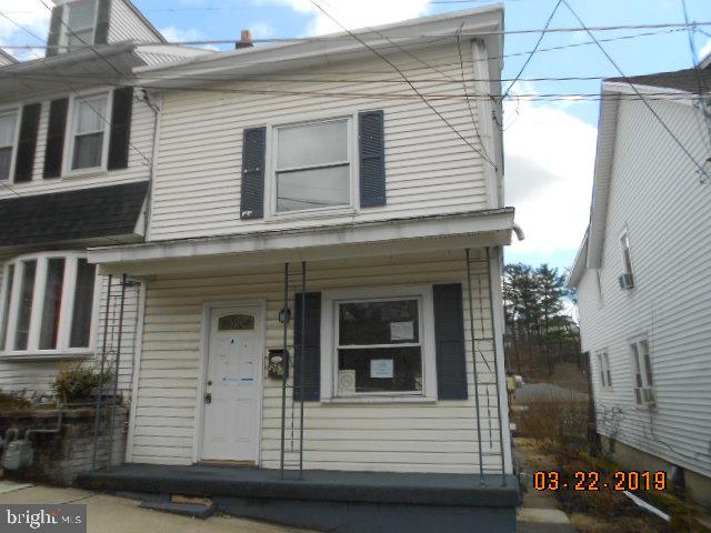 Corporate owned property being sold as-is condition with no sellers disclosure. Purchaser is responsible for the 2% transfer tax, all inspections, permits and all costs associated with them. POF required at time of offer. Built prior to 1978 so lead based paint is probable. This property may qualify for Seller Financing. End of row home in Pottsville with an updated over sized kitchen with plenty of cabinet and counter space. Full bath on the main level along with living room and dining room. Second floor offers three bedrooms and another full bathroom. Bonus of off street parking in the back of the home. This might be the one that you will call HOME...