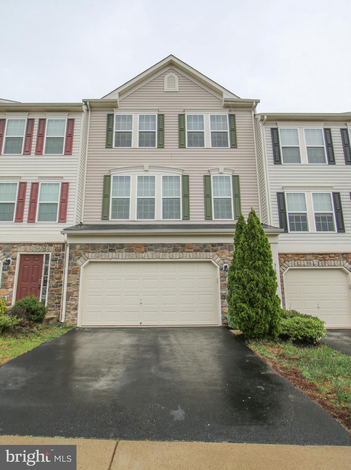 Amazing Upgraded Stone Frnt TH in Stone Ridge. Beautiful open main lvl w/ hdwd flrs, 1/2 BA, gourmet kit w/ island, SS, wall ovens, & more off from cozy fam rm w/ gas fp, & access 2 deck. Perfect 2 entertain. Upper lvl 3BR 2BA. MA w/ vault ceil, walk in closet, & oasis BA w/ sep tub/shower, tile, & 2 vanities. Lower lvl vast rec rm, lndry, rough in full BA, & access 2 fenced yd which backs 2 pond!