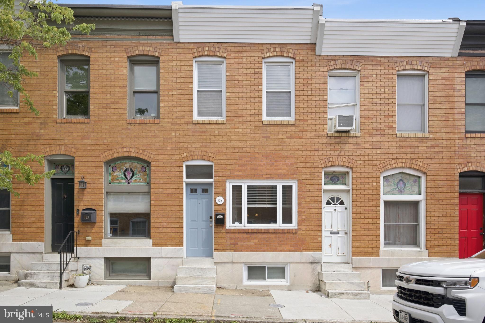 This classic Canton brick townhouse offers 3 bedrooms, 2 full bathrooms, and a flexible layout that grows with you. Tucked into one of Baltimore's most beloved neighborhoods, 735 S Curley Street delivers the charm, versatility, and peace of mind today's buyers are searching for.

Upstairs, two comfortable bedrooms share a full bathroom, creating an inviting primary living space. The lower level adds the option for a third bedroom and includes a full bathroom. Use it as a home office suite, guest retreat, creative studio, or work-from-home sanctuary.  A back room rounds out the space with laundry and additional storage, keeping everything neatly tucked away.  However your life is organized right now, this home has room to flex with you. 

Outside, a dedicated parking pad takes one of Baltimore's most universal headaches off the table.

This is a home that has been cared for. The seller invested in what matters most: a new roof in June 2022 backed by a 20-year warranty through Charm City Roofing, a new front door in August 2023, fresh blinds and carpet that same summer. With a newer water heater (2019) and HVAC (2018) already in place, this turnkey Canton home is genuinely ready for its next chapter.

The location delivers too. You're steps from the energy of Canton Square, a short stroll from the historic waterfront of Fells Point, and perfectly positioned for scenic waterfront runs and walks. Restaurants, coffee shops, retail, weekend events: all of it is woven into the fabric of daily life here.

The big-ticket items are handled. The neighborhood is exceptional. The layout is genuinely flexible. The only thing missing is you. Schedule your private showing today, because homes like this don't last long in Canton.