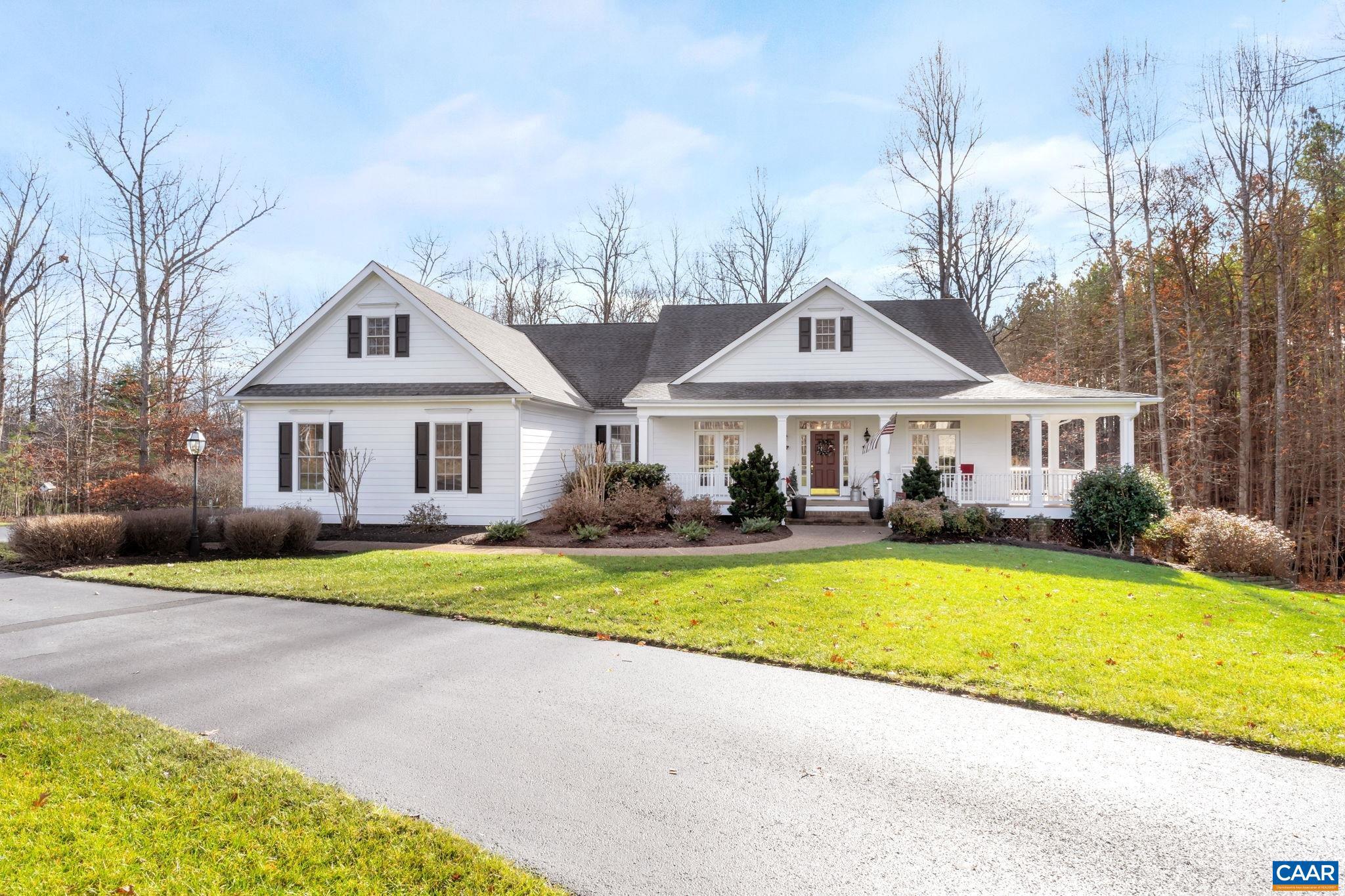 One level living, truly custom, meticulously maintained home carefully placed on 2+ acres with a winter mountain view. The first floor offers a morning room, great room with vaulted ceiling and brick fireplace, home office, dining room, primary bedroom with french doors leading to a screened-in porch, guest ensuite, and a full bath. Columns, custom trim, and hardwood floors showcased throughout. The kitchen boasts custom birch shaker style cabinets, solid surface counters, stainless appliances, gas cooktop, and large walk-in pantry. Large wrap around front porch overlooking a beautiful landscaped yard, spacious deck for entertaining and screened-in porch. Oversized garage, generator, security system, and architectural roof.,Birch Cabinets,Solid Surface Counter,Fireplace in Great Room