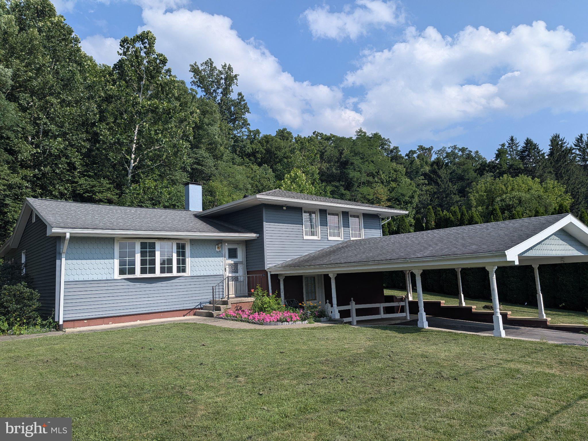 This charming split-level home, built in 1960, offers a perfect blend of comfort and functionality. With four spacious bedrooms and three full bathrooms, it's designed for both relaxation and entertaining. The partially finished basement has a Rec Room, 2 of the full bathrooms, 1 of the bedrooms, and a laundry room. Additional features include a walk-in tiled shower in the primary suite, a whole home generator, and the very unique feature of an elevator for all 4 levels. With the handicap ramp access from the carport, this makes the home wheelchair accessible. Recent updates include a new roof in 2019, new kitchen appliances in 2020, and a new furnace in 2023. The property also includes an outbuilding for extra storage and a 2 car attached carport for easy parking. Located in a welcoming community, this home is just a short distance from local parks, providing plenty of opportunities for outdoor activities and relaxation. The neighborhood is known for its friendly atmosphere and convenient access to public services. Nearby schools are well-regarded, making this an ideal spot for those seeking a vibrant community. This home is ready for you to move in and make it your own. Experience the comfort and charm of this delightful property, where every detail invites you to create lasting memories.