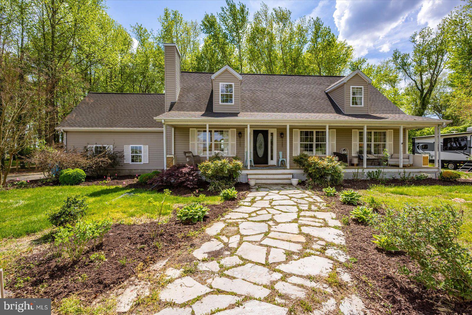 Beautifully updated 4-bedroom, 2.5-bath home situated on over two acres in Berlin with no city taxes! This private property features a freshly graveled, long driveway. Inside, you’ll find all new flooring throughout, fresh paint, and a refinished hardwood staircase with a custom banister. The home is enhanced with all new lighting and fixtures, along with updated bathrooms featuring new vanities, faucets, and elegant porcelain sinks. The kitchen has been thoughtfully upgraded with butcher block countertops, a high-end backsplash, and a custom hood over the range.  Additional highlights include a custom laundry room, a newly designed master closet, and new gutter guards. Outside, a brand-new fence completes the property, providing both privacy and functionality of over an acre. This home offers modern upgrades in a serene setting just minutes from everything Berlin has to offer.