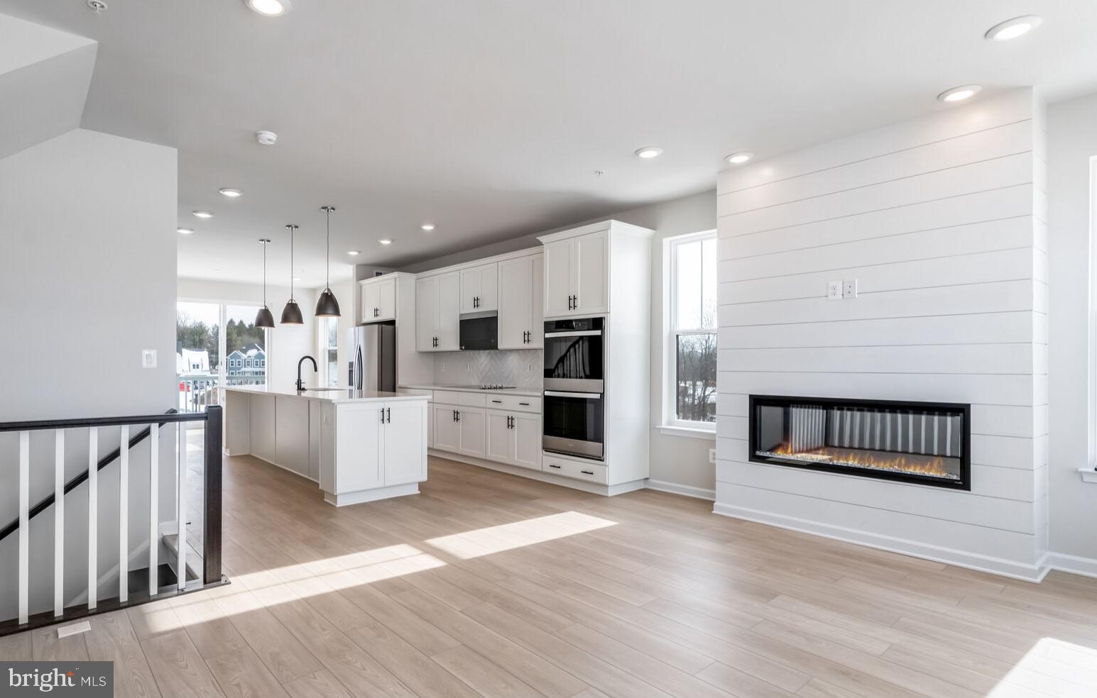 **Up to 25K IN FLEX CASH WITH USE OF PREFERRED LENDER AND TITLE! Lower your price, cover your closing costs, or buy your rate down**
 Lower your price, cover your closing costs, or buy your rate down**See Sales Consultant for details**
Brand New Townhome READY NOW at Tuscarora Creek East, the only brand new townhomes with modern farmhouse exteriors. Welcome to the Harlow II, a luxurious townhome with impressive functionality! As you enter the lower level of the home through the main entryway or attached 2-car garage, a secure and weather-protected option, you will discover a rec room complete with a powder room. Ascending to the second level, you will be greeted by an open-concept chef's kitchen, breakfast area, and family room. Sunlit, open and airy, this space features a long, spacious island with pendant lighting and quartz countertop. Modern linear fireplace adorns the family room area. Venturing to the third level, you will find a luxurious primary suite complete with a tray ceiling— an elegant touch! This spacious getaway opens to an oversized walk-in closet with ample space for all of your belongings, and an ensuite bathroom with dual vanity sinks and a seated shower. The laundry room is located just down the hall, conveniently accessed by all bedrooms. We can't wait to welcome you home to Tuscarora Creek East!! Call for your personal tour today!