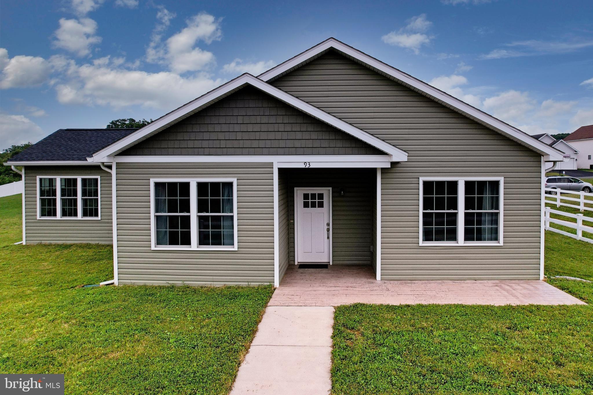 Welcome to 93 Candlewick Court in the desirable Prichard Farms Subdivision of Frostburg, Maryland!
Built in 2022, this beautifully maintained 3-bedroom, 2.5-bath home offers the perfect blend of comfort, style, and easy one-level living. From the moment you step inside, you will feel the open and airy design, highlighted by vaulted ceilings in the living room and kitchen, warm natural light, and a welcoming layout made for everyday living and entertaining.  The spacious kitchen is a true centerpiece of the home, featuring a large island, cherry cabinetry, granite countertops, and plenty of workspace. All appliances convey, including the refrigerator, dishwasher, gas stove, washer, and dryer, making this home truly move-in ready. The living room offers a cozy gas fireplace beneath the vaulted ceiling, creating the perfect space to relax and unwind.  Enjoy the added bonus of a large sunroom with a sink hookup, offering endless possibilities for entertaining, hobbies, plants, or simply enjoying the peaceful surroundings and mountain views. The primary suite features a comfortable layout with a nice walk-in closet, full bath with a walk in tiled shower, giving you the private retreat you deserve.  Additional features include central air, forced-air natural gas heat with a 40,000 BTU system, radiant heated floors throughout — including the garage — and an oversized 23 x 26 two-car garage with insulated doors and attic storage space. Step outside and enjoy the patio, community setting, and beautiful views that make Prichard Farms such a sought-after place to call home.  The HOA is only $360 per year and covers common grounds, snow removal, and community landscaping, allowing you to enjoy a low-maintenance lifestyle. Conveniently located close to Frostburg State University, shopping, restaurants, medical facilities, and I-68 East and West, this home offers comfort, convenience, and charm all in one package.  93 Candlewick Court is a must-see! Call today to schedule your private tour.