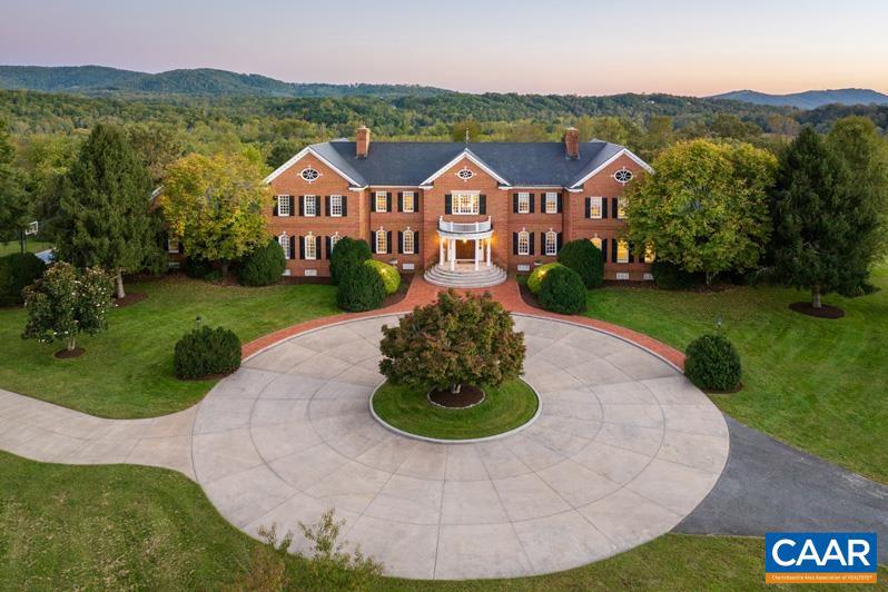 Bentivar Manor - Nestled on over 88 acres of pristine and very private land very close to Charlottesville! This magnificent brick manor home stands as a testament to luxury and refinement. Boasting over 11,600 square feet of finished living space, this estate offers an unparalleled blend of elegance and tranquility. The manor home exudes charm, and showcases superior craftsmanship and attention to detail throughout. Perched upon a gently rolling and elevated knoll, the residence commands panoramic vistas of picturesque fields, mountains, and forests, creating an idyllic retreat just six miles from the heart of Charlottesville. Designed for both relaxation and recreation, the property features extensive trails and boasts long frontage along the Rivanna River. The estate offers an array of amenities, including pastures ideal for keeping animals, a spacious fenced yard complete with a sparkling swimming pool and an impressive professional pickleball court. Several expansive terraces and porches provide additional spaces for entertaining. This captivating estate offers the epitome of luxury living, and a terrific venue for entertaining both small and large groups. PRICED SUBSTANTIALLY BELOW TAX ASSESSMENT!!!,Cherry Cabinets,Granite Counter,Wood Cabinets,Fireplace in Dining Room,Fireplace in Family Room,Fireplace in Living Room