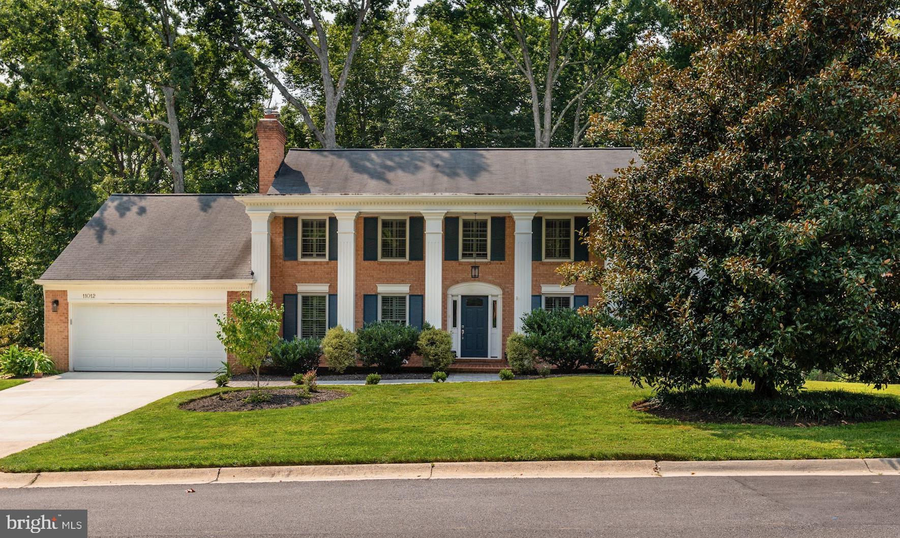 Welcome to 11012 Powder Horn Drive, a fantastic all-brick colonial perfectly nestled in the charming neighborhood of Fox Hills in Potomac, Maryland. This five bedroom, three and a half bathroom home features over 4,000 square feet of finished space on a wonderful 0.4 acre lot backing to wooded parkland. This beautifully updated home, has new windows and doors, a fabulous kitchen with large island, renovated bathrooms, screened porch, and a fully finished, walk-out lower level with unobstructed views. The main foyer welcomes you with a graceful curved staircase, hardwood floors that extend throughout the main floor, and original dental moldings that continue in the living room and dining room. The spacious family room showcases an exposed brick fireplace with an extended decorative wood mantle and new gas log insert (with remote).  Windows facing the front and side of the home are dressed in plantation shutters to complement the home’s classic exterior while recessed lighting provides modern, functional illumination throughout this level. The tastefully updated kitchen has new stainless-steel appliances, a custom marble backsplash, wood cabinetry with roll-out drawers, quartz countertops, dual ovens, a five-burner Wolf gas cooktop with vent hood, dual sinks with garbage disposals, beverage cooler, and a cook’s bookcase. The kitchen opens to the eat-in table space with  convenient access to the screened-in porch and adjacent Trex deck. A large mudroom connects to the two-car garage but also provides access from the deck and through a side-door.  This space includes a large cedar closet, a storage closet, and front-loading Whirlpool washer and dryer. The updated powder room is tucked away in the short hall between the family room and mudroom. The dining room offers bright and sunny forest views from the  oversized windows and can comfortably accommodate a large dinner party. The living room is the ideal place to lounge, offering a comfortable seating area and windows with front and side yard views. The upper level hosts four bedrooms, two fully renovated bathrooms and showcases hardwood floors throughout. The primary bedroom offers a walk-in closet with a sliding door and a newly renovated ensuite bathroom featuring designer tile floors, large vanity with dual sinks, a custom tile walk-in shower and a pocket door enclosing the water closet. Three additional bedrooms complete this level and a generously sized hall bathroom offers a large vanity with dual sinks, linen closet and a custom tile shower/tub. A spacious hall linen closet and dedicated heating/cooling system rounds out this level, giving you the storage space and year round comfort you need. The walk-out lower level is fully finished with four sets of sliding glass doors that connect you to the flagstone patio and and fenced backyard. The oversized living area includes a custom brick wood-burning fireplace with rustic mantle and this open layout offers additional space for a work area and/or gym. A fifth bedroom was added to this level with a fully renovated bathroom showcasing designer tile and oversized tub.  The bedroom is accessed through a private hallway that includes two bedroom closets and direct bathroom access, which can provide suite-like privacy for a nanny or additional family member.  There is an option for keyed, separate access.  A large, finished storage room provides a place to tuck away any larger items.The backyard offers both an upper level deck and an enlarged lower level patio area that can easily accommodate a fire-pit and seating area. The fenced lot surrounded with wooded views provides a serene background to be enjoyed. The location of this home could not be more ideal being walking distance to Bells Mill Elementary, Cabin John Middle School and Winston Churchill High School. This walkable neighborhood easily connects to trails and is in close proximity to Cabin John Park and multiple neighborhood pools and tennis clubs.