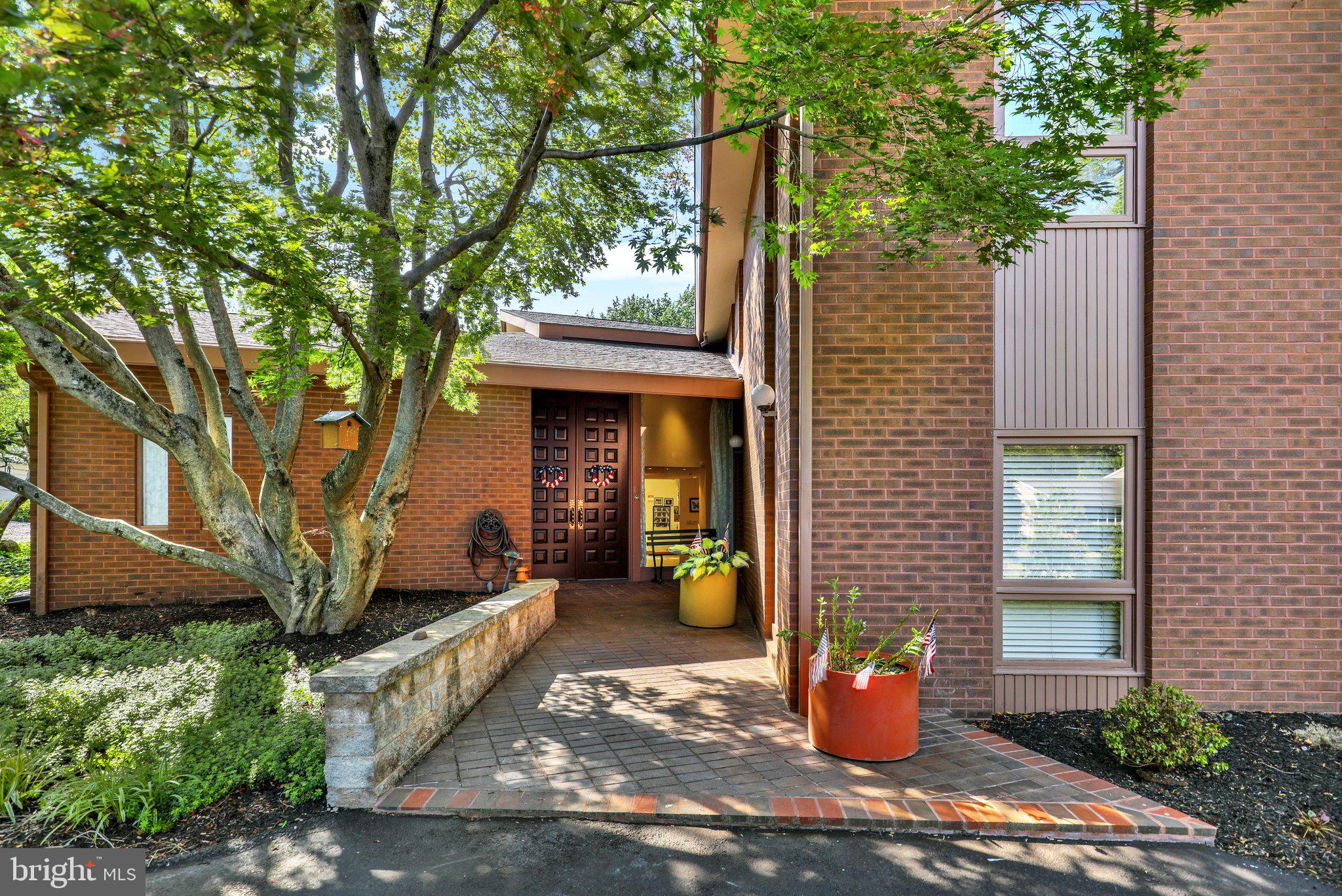 Tucked into Wyomissing’s beloved Birdland neighborhood, 1617 Meadowlark offers the kind of everyday living that feels both elevated and effortless. From the moment you arrive, the circular drive and striking entry set the tone for a home designed to make life feel a little more special—whether you’re welcoming guests, celebrating milestones, or simply enjoying the comfort of a space that has been thoughtfully cared for over the years.
Inside, the home’s custom design creates a sense of openness and flow that is ideal for both lively gatherings and quiet moments at home. The expansive ballroom invites you to imagine holidays, celebrations, creative pursuits, or the ultimate flex space tailored to the way you live, while the bright sunroom and private backyard with a saltwater in-ground pool offer a peaceful escape for relaxing, recharging, and enjoying the beauty of every season.
Conveniences like the three-stop elevator and the recently updated main bath with steam shower and walk-in tub bring ease and comfort to daily life, while the home’s bright secondary bedrooms and carefully maintained spaces make it easy to settle in and feel at home right away. Designed by Elmer Veres  of Muhlenberg, Greene and Veres and lovingly maintained by its original owners, this is a rare opportunity to enjoy a home with character, warmth, and room to truly live well.
