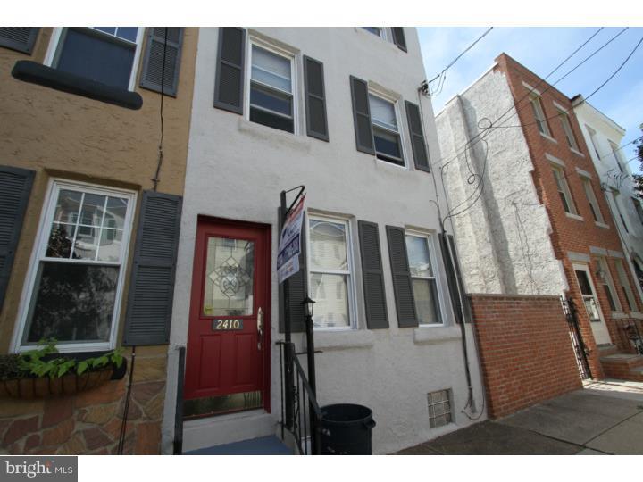 Charming 3 Story 3 Bedroom 1.5 Bath home with many upgraded features. This home offers 2 out door spaces including a deck off of the 2nd floor and a large cement fenced in rear yard on the 1st floor. The property foot print goes street to street. The 1st floor has hardwood floors, exposed brick, recessed lighting and a formal living and dining room divided bay the stairs and a powder room with pedestal sink. The dining room is open to the eat-in kitchen. Kitchen features include Bosch dishwasher, LG French door refrigerator with pull out freezer drawer, gas range and microwave. Beautiful granite counter tops and there is access to the yard from the kitchen. The 2nd floor has a large bedroom with access to the rear deck, and a full hall bath with a stall shower and a soaking tub with shower. The 3rd floor offers 2 big bedrooms and closet space. This property has a full unfinished basement used for laundry and storage and this property
