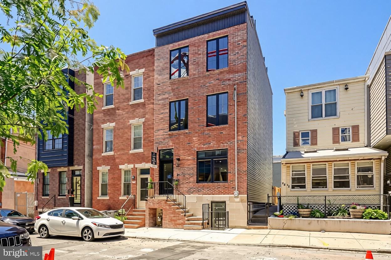 ** Ask for VIDEO TOUR ** Welcome to your thoughtfully crafted new construction home, in Fishtown. This home includes a 1 YEAR WARRANTY. Ask about the 10-YEAR TAX ABATEMENT! This spacious home sits on a 18’ wide and 107’ deep lot, offering 3 bedrooms, 3 full bathrooms, and two bonus rooms—perfect for guest accommodations, an office, or a gym. The design blends classic Philadelphia charm with modern elements, featuring premium earthy finishes. Among its contemporary amenities are multiple private outdoor spaces, a 65' rear backyard, and ample storage. This location is prime for you to enjoy everything Fishtown has to offer. Explore a variety of restaurants, bars, shops, cafes along Frankford and Girard Avenue. The waterfront is just a quick walk away, providing more parks and entertainment options. You’ll also find a wealth of dining and entertainment in Northern Liberties and Old Kensington nearby. Plus, you’re close to Fishtown Montessori School, PlayArts, and a sprayground. For easy commuting, you have quick access to Highway 95, the Ben Franklin and Betsy Ross Bridges, Philadelphia International Airport, and the Market-Frankford Blue Line, which connects you to Old City, Center City, and other areas. Complementing this desirable location are the classic exterior features of the home including a red brick facade and black double casement French windows beneath a stylish black cornice. An elevated front entrance enhances privacy for the main living level. Inside wide plank French oak floors spread across an open layout connecting the living and dining areas to the gourmet kitchen. Desirable natural light consumes the entire home from the front and rear. Soft recessed lighting and curated fixtures throughout offer versatile options, from bright and functional to warm and ambient. For added efficiency, this home is furnished with two HVAC systems. Designed for both functionality and aesthetics, the kitchen features GE Café appliances, a 36” professional gas range, and quartz countertops with matching backsplash. Mounted over the oven is a custom 36” hood flanked by soft lighting sconces and a long spice shelf. The kitchen island offers a deep sink and a place to sit or prep. Ample cabinetry, including three built-in pantries and a closet with opaque glass doors, ensures optimal storage. Through the sliding doors, the spacious 65’ back yard is perfect for outdoor dining, a large garden, and an area for pets. The finished basement provides additional living and storage space including two separate rooms each with their own closets and egress. In the hall, a full bathroom is finished with an Italian tile walk-in shower with bench and oak vanity. Leading upstairs, the oak staircase is well-lit by recessed tread lights. There are two bedrooms on this floor, including a walk-in closet in the front room. All bedrooms above grade have generous windows allowing in plenty of natural light. The hall features a full bath finished with Italian tile, a deep-set tub and shower, textured porcelain floors, and a double sink oak vanity. Additional features include a built-in laundry closet and a separate linen closet. On the third floor, the primary suite showcases french doors leading through the custom organized closet into a spa-like bathroom. Double doors open to an oversized 71” soaking tub against a full wall of Italian tile. The bathroom also features a tiled walk-in shower with bench, separate toilet room, double sink vanity, and a linen closet. Enjoy stunning unobstructed views of the Philadelphia skyline from your spacious roof deck. Buyers are responsible for verifying taxes and square footage.