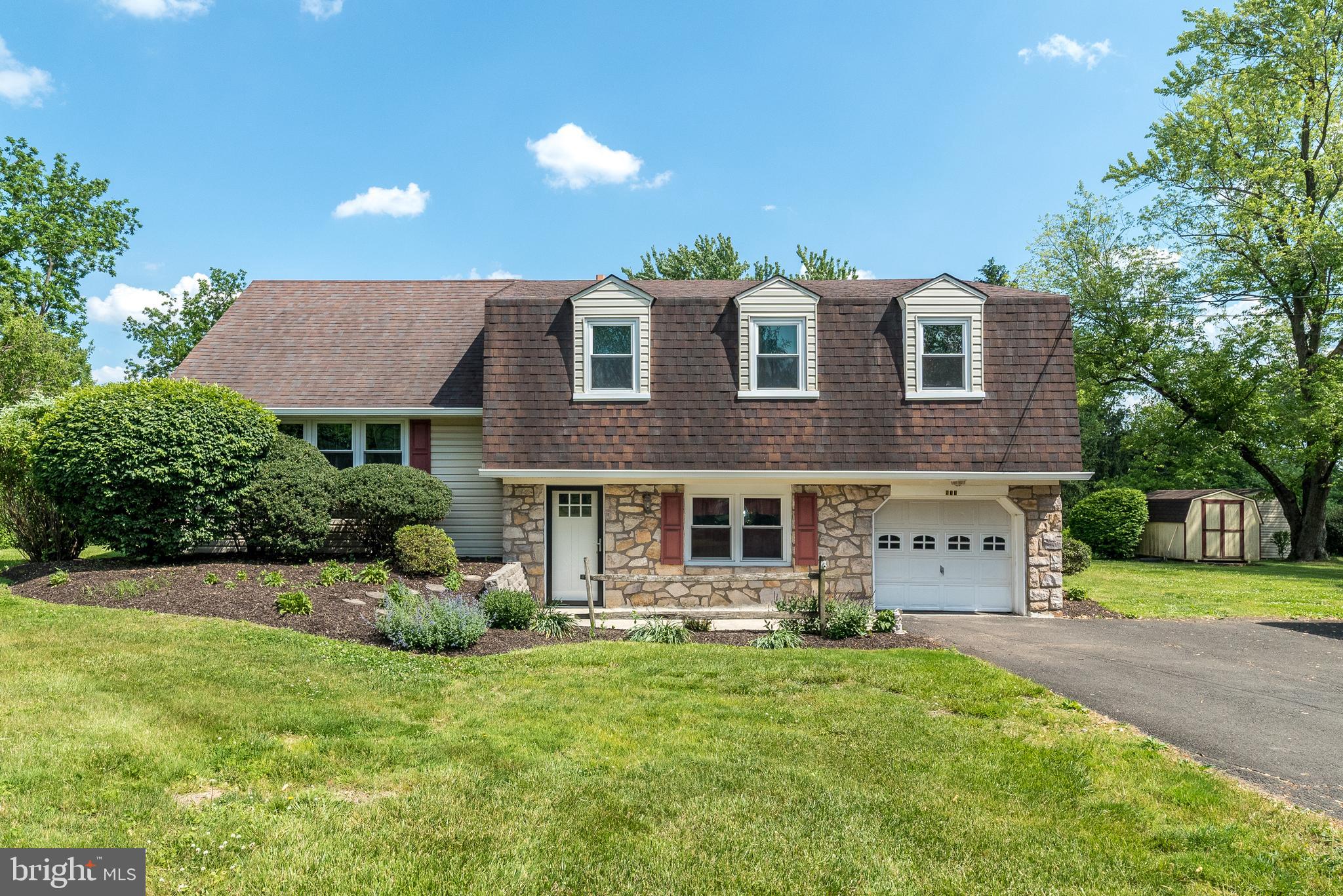 Welcome to this beautifully maintained split-level home nestled in the heart of Hilltown, just minutes from the natural beauty of Peace Valley Park, where walking trails, boating, fishing, and scenic Bucks County views await. From the moment you arrive, you’ll appreciate the exceptional pride of ownership showcased through the home’s attractive curb appeal, manicured landscaping, and inviting presence.
Step inside to a bright and welcoming  foyer entry which lead you into the living room filled with natural light from oversized windows, creating a warm and comfortable atmosphere perfect for everyday living and entertaining alike. The living space flows effortlessly into the expanded kitchen — thoughtfully redesigned by the current owners to become the true centerpiece of the home. Featuring abundant cabinetry, luxurious quartz countertops, ceramic tile flooring, and beautiful views overlooking the backyard, this kitchen offers both style and functionality for today’s lifestyle.
Just a few steps down from the main living area, you’ll discover an expansive lower-level family room offering endless flexibility for gatherings, movie nights, play space, or a home office setup. This level also includes a convenient powder room, laundry area, and direct access to the spacious garage.
Upstairs, you’ll find three generously sized bedrooms, all with new carpeting and hardwood flooring beneath, ample closet space, and plenty of versatility for family, guests, or remote work needs. The oversized hall bathroom features a double vanity and a tub/shower combination with dual access from both the hallway and the primary bedroom for added convenience.
Step outside and enjoy your own private outdoor retreat. The maintenance-free deck located just off the kitchen creates the perfect setting for outdoor dining, relaxing, or entertaining while overlooking the expansive backyard surrounded by mature landscaping. Whether hosting summer barbecues, gardening, or simply enjoying peaceful mornings with coffee, this outdoor space offers privacy, tranquility, and room to enjoy every season.
Additional valuable upgrades include newer windows and front door, a roof and siding replacement completed in 2016, and a generator hookup for added peace of mind. Lovingly cared for and meticulously maintained throughout the years, this move-in ready home offers the perfect blend of comfort, charm, and convenience. Ideally located near parks, shopping, dining, and major commuter routes, 511 Upper Stump Road presents a rare opportunity to enjoy both serenity and accessibility in one of Bucks County’s most desirable locations.