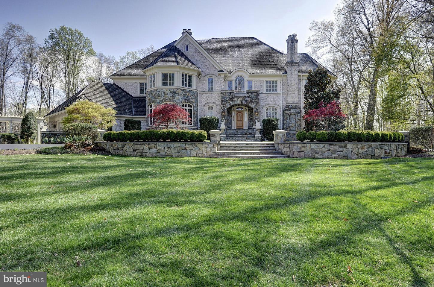 Sited on an idyllic five acres, this lovely custom home is handsomely presented at the end of a large circular drive * Sit on the back terrace and enjoy sweeping views of the expansive yard with tennis court, gazebo, cabana, pool and patio framed in towering trees * Designed with a European flair this richly appointed house is perfect for both large functions or smaller intimate gatherings