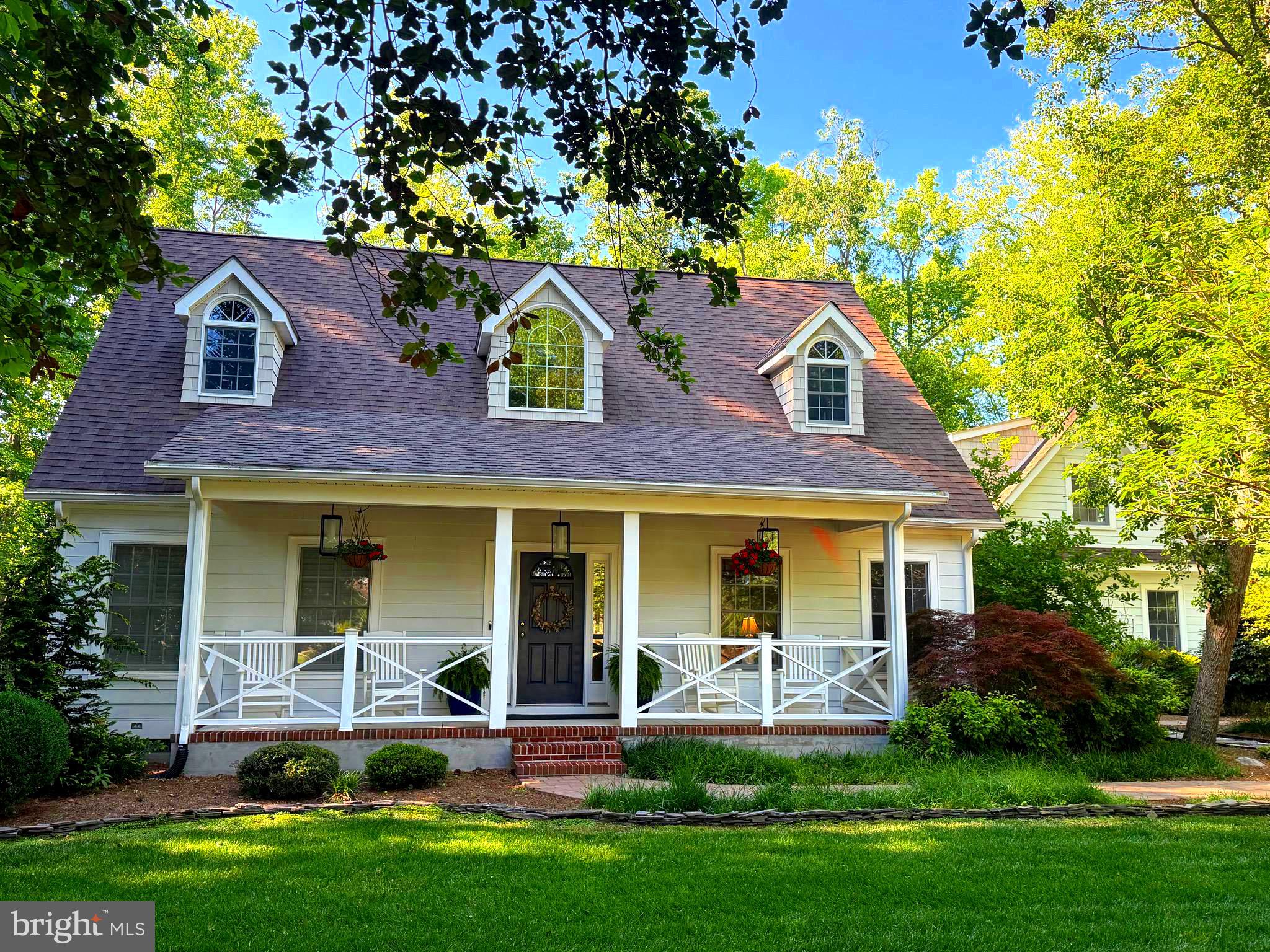 Quiet & serene, yet close to it all! 17 West Side Drive, a charming 5-bedroom, 2 full and 2 half-bath Cape Cod in the popular Rehoboth Beach Yacht and Country Club community. At 0.71 acres, it sits on one of the largest lots in RBYCC! The picturesque backyard is an entertainer’s dream, featuring a private 16x32-foot in-ground heated pool with an automatic cover, beautiful landscaping, mature trees, a fire pit, and an outdoor shower. Just imagine the memories you’ll make in this one-of-a-kind backyard oasis! The luxury and comfort continue as you enter the home, where you’ll be treated to vaulted ceilings and a spacious, open-concept living space. The kitchen is a masterpiece, featuring an oversized island with a beverage fridge and seating for 4, ample storage, a clean, modern white subway-tile backsplash, a 36-inch Wolf range with an integrated infrared griddle surface, and a custom hood vent. A cozy seating nook sits below an expansive bank of windows overlooking the beautiful private pool. The kitchen also offers access to the mudroom and "drop zone" with built-in cabinetry, a separate entrance to the front and backyards, and an entrance to a newly built media room on the first floor, with an additional bedroom and half bath above. Back in the kitchen, a dining area and an adjacent sitting area with built-in bookshelves and a window seat complete the picture. The kitchen flows into a spacious and cheerful sunroom with EZ-Breeze windows, slate floors, and a wood-burning stove for those cooler evenings. Just off the living space is the primary suite, which features clean, contemporary grasscloth wallpaper, lots of light, and plantation shutters. The attached primary bath offers a custom-tiled shower, double vanity, and generous closet space. On the second floor of the main house, you'll find 2 additional bedrooms with a shared hallway bath. Just like the rest of the home, the mechanicals have also recently received an upgrade! The electrical service has been upgraded to a 400-amp system capable of powering just about anything you can think of. The second-floor HVAC system was replaced in 2024, and both HVAC systems offer propane heat. Exterior upgrades include Hardie plank and NuCedar siding, updated porch railings, composite decking, and new lighting. This renovation thought of absolutely everything! This popular community is in close proximity to all that downtown Rehoboth Beach has to offer. An RBCC membership can be purchased separately and offers fine dining, access to an 18-hole golf course, a community pool, tennis courts, pickleball, and more. This home is truly special and is just waiting for its new owners to come put their personal touches on it. Live in luxury by making 17 West Side yours today!