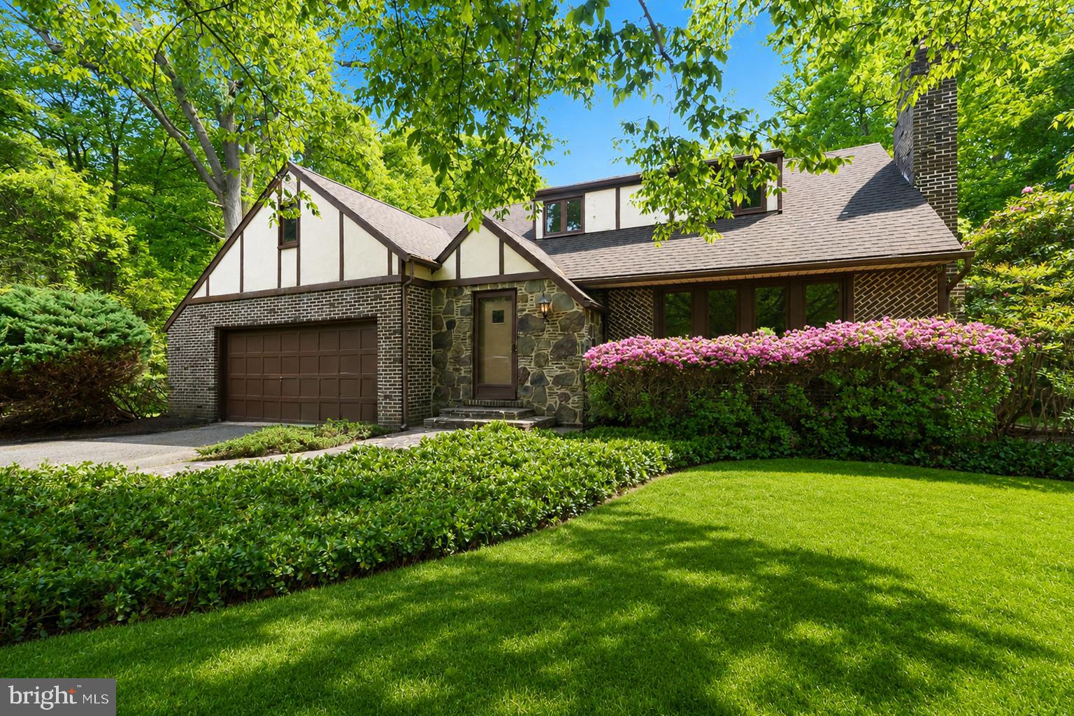 Beautifully maintained and freshly painted Tudor-style home set on approximately 1.72 private acres in Monkton. Combining timeless architectural character with thoughtful updates, this 4-bedroom, 2.5-bath residence features refinished hardwood floors, spacious living areas, and beautifully landscaped outdoor spaces.

The main level offers a welcoming foyer, expansive living room with fireplace, formal dining area, and a spacious kitchen with abundant cabinetry, generous prep space, and seamless flow for everyday living and entertaining. Large windows throughout the home provide abundant natural light and views of the surrounding property.

Upstairs, you’ll find three traditional bedrooms plus a fourth bedroom currently configured as an office/bonus room, offering flexible space for remote work, hobbies, guests, or additional living needs. The upper level is served by two full baths, including a spacious primary bath.

Outdoor living is a standout feature of the property, with mature landscaping, stone pathways, multiple seating areas, and an in-ground concrete pool that is open, operational, and ready for summer enjoyment. The attached 2-car garage and long driveway provide ample parking and convenience.

A rare opportunity to own a well-cared-for Tudor-style home with refreshed interiors, classic charm, and exceptional outdoor space in a scenic Monkton setting.