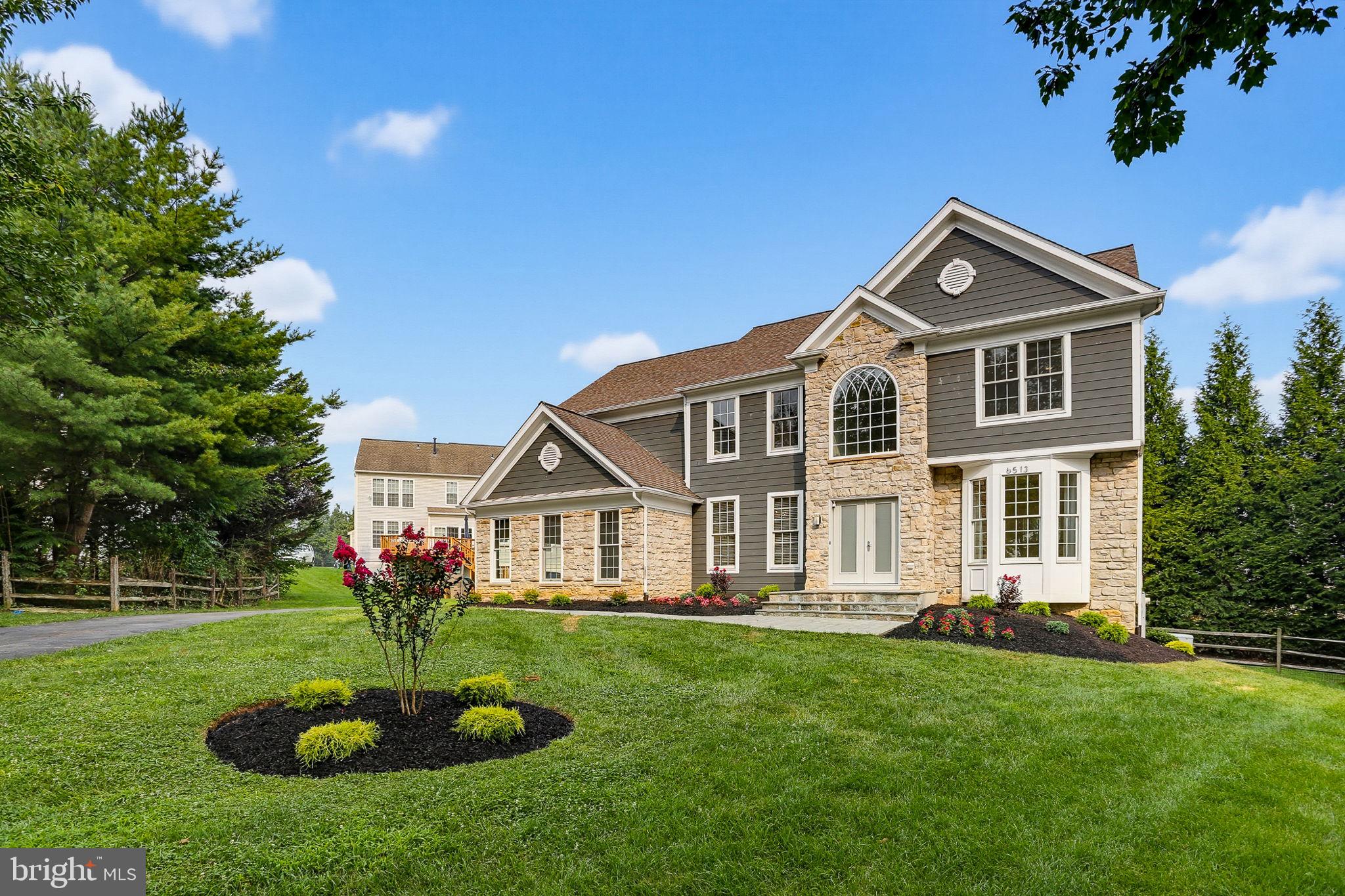 Unparalleled luxury in this professionally landscaped 5-bed, 4.5-bath estate in Clarksville's sought-after Clarks Glen. Highlighted by a gorgeous chef's kitchen with sunroom, a breathtaking 2-story family room, and a daylight in-law suite in the finished walkout lower level, this .31 acre, move-in-ready home offers an unbeatable blend of elegance, privacy, and community.
Inviting Entry: Double front doors open to a soaring 2-story foyer with replaced high end staircase. Home Office: Separate main-level workspace features French doors and bright bay windows. Living & Dining: Formal areas framed by picturesque views of colorful flower gardens and lush evergreen trees. Custom Kitchen: includes a waterfall granite island, premium Thermador appliances, built-in beer and wine coolers, and a sunroom with 3-side glass windows transitioning to an expansive covered porch plus open deck overlooking a private, wooded setting. Upper Level: a 2nd rear stairway leads conveniently to 4 generous bedrooms with custom closets, ceiling fans, LED lighting,  window treatments, and wall mount TV wiring kits, along with 3 beautifully updated bathrooms. Daylight Walkout Basement: Designed as a fully functional in-law suite with a 5th bedroom, 4th en-suite bath, walk-in closets, and a secondary laundry. Lower Level Perks: showcases a full 2nd kitchen, versatile recreation area with built-in shelves, a 2nd half bath, and a French door stepping out to a large patio in the fenced backyard surrounded by mature trees. Mechanicals: Major systems have been replaced or updated, plus an upgraded generator to keep your home running during power outages. Anderson windows and doors replaced throughout the house. Neighborhood: Enjoy a low annual HOA fee of $253. Just a few steps to a wonderful park in the heart of the community where sports and parties are held, kids play together, neighbors meet and chat.
Commuting: Minutes from the River Hill schools, local shopping, and Routes 108, 32, 29, and 95 for easy access to Baltimore, D.C., Rockville, and Annapolis.
