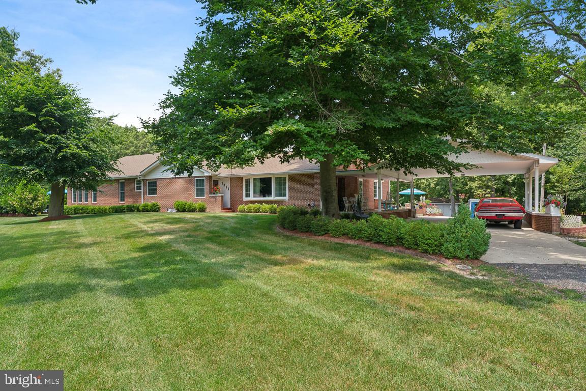 RARE 3.9-ACRE PRIVATE SANCTUARY - Discover the ultimate blend of privacy and luxury in this sprawling 4-bedroom, 4.5-bath brick rambler, perfectly situated on nearly 4 acres of serene Accokeek landscape. Designed for modern living, this home offers a rare layout where EVERY bedroom features its own private en-suite bath, ensuring unmatched comfort and privacy for family and guests.

Step inside to gleaming hardwood floors and a spacious primary retreat complete with a private sitting area. The fully finished lower level is an entertainer’s dream, boasting a custom wet bar, home gym, and flexible living zones for movie nights or extended stays.

A rare bonus for hobbyists and work-from-home professionals alike, the property includes multiple dedicated garage structures, including a spacious 2-car garage, a single car garage, plus a separate 1-car garage with a finished workshop area. Rounding out the outdoor offerings are two additional storage sheds, providing ample space for tools, equipment, and everything in between.

Enjoy quiet mornings in the screened gazebo or host gatherings on multiple patios overlooking your private acreage. No HOA! Minutes to commuter routes, shopping, and dining, yet worlds away from the noise. This is the standout opportunity you’ve been waiting for—schedule your tour today!