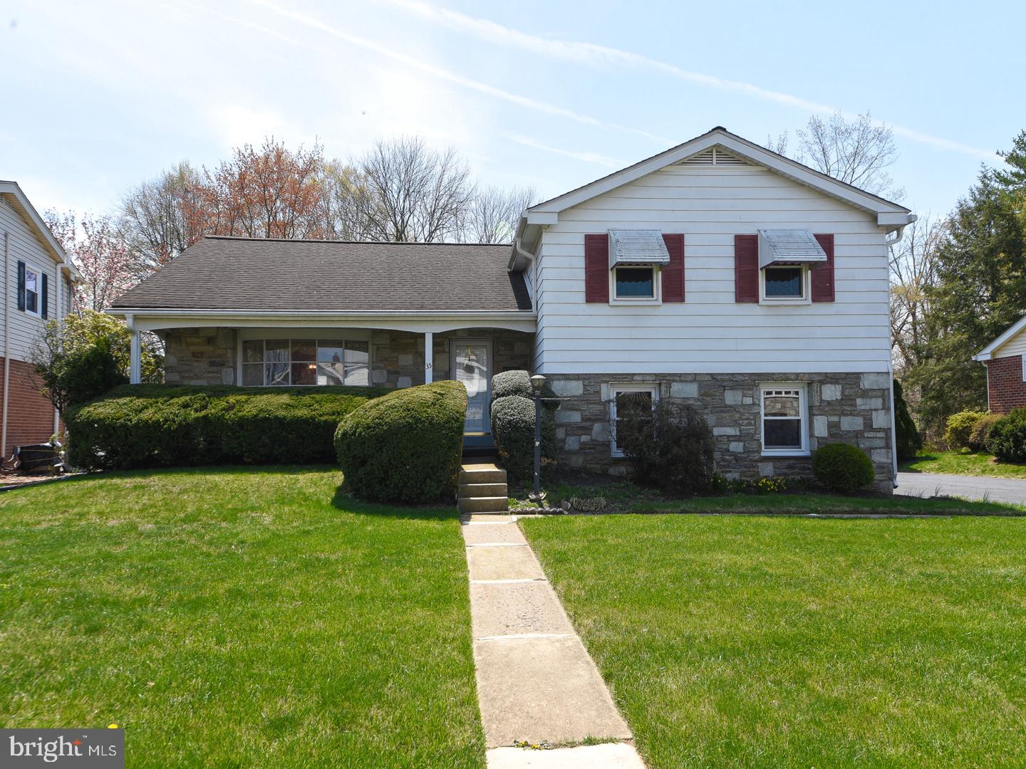 Welcome to 35 Oakland Avenue – Your “Home Sweet Home”! Nestled in the heart of highly sought-after Lansdale, this well maintained split-level single-family residence blends comfort, style, and functionality in one exceptional package. With 3 spacious bedrooms and 2.5 bathrooms, this home exudes pride of ownership from the moment you arrive. The charming stone and siding exterior, paired with a welcoming covered front porch and classic flagstone flooring in the foyer, creates a lasting first impression. Step into a sunlit living room, highlighted by a beautiful bay window, flowing effortlessly into the formal dining room with elegant chair rail molding—perfect for entertaining or cozy family dinners. Glass sliding doors lead you to a covered patio and an expansive backyard oasis, complete with a heated above-ground pool, two storage sheds, and room to host unforgettable summer gatherings or enjoy peaceful moments outdoors. The heart of the home—the gourmet eat-in kitchen—has been tastefully updated with granite countertops, tile backsplash, double wall oven, and electric cooktop—a dream come true for the home chef. Downstairs, the spacious family room features a brick wood-burning fireplace, ceiling fan, and sliding doors to the backyard. This level also includes a laundry room with storage and utility sink, a powder room, and access to the two-car garage with a built-in workbench and extra storage space. Upstairs, retreat to the primary bedroom suite with ample closet space, ceiling fan, and a private tiled en-suite bath with a tiled shower and linen closet. Two additional bedrooms share a beautifully tiled hall bath with a tiled tub/shower combo and second linen closet. Storage will never be an issue, thanks to two hallway closets and a walk-up floored attic. For added peace of mind, the seller is including a one-year America's Preferred Home Warranty. Located in the top-rated North Penn School District, you're just minutes from the Montgomeryville Mall, Shoppes at English Village, Whites Road Park and Pool, and countless dining and shopping options. Plus, enjoy quick access to major routes and the Lansdale, North Wales, and Pennbrook SEPTA train lines, making commuting or day trips a breeze. This exceptional property truly has it all. Come experience the lifestyle you’ve been dreaming of—welcome to 35 Oakland Avenue.