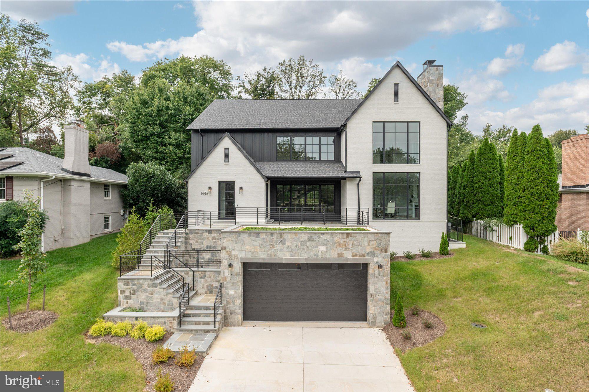 Cherry Hill Custom Homes presents this exceptional new home in the sought after Potomac Hills neighborhood of McLean. Prominently sited on an elevated .37 acre lot, this transitional Tudor design is accentuated by elements of brick, and stone, and beautiful floor-to-ceiling Weather Shield windows. The home features 6 bedrooms, 7 full bathrooms, and one powder room with 7,485 square feet of thoughtfully designed living space over three levels. The main level includes 10ft ceilings, gorgeous wide-plank engineered white oak wood floors, a beautiful gourmet kitchen with frame-less custom cabinetry, quartz countertops, and paneled Thermador appliances. The kitchen opens to a great room with exposed beams and a linear gas fireplace with tile surround, wood mantle, and flanking built-ins. Adjacent to the kitchen is a spacious dining room with coffered ceiling and tons of natural light. The bluestone screened porch with motorized screens and flush-mounted heaters provides an amazing outdoor living space overlooking the back yard with plenty of room for a swimming pool. A guest suite, private study with fireplace and built-ins, separate powder room, a stunning floating staircase, and a large bluestone front porch round out the main level living spaces. The upper level is highlighted by a luxurious primary suite with walk-in closet with built-ins, a spa-like bathroom with heated floors, double vanities, stand-alone soaking tub, and heavy glass enclosed shower. The walk-up lower level includes a recreation room with walk behind wet bar and wine room, a home gym with rubber flooring. an en-suite bedroom, two mudrooms with connectivity to the oversized two car garage and the areaway, a separate laundry room, and an additional full bathroom. This home has a built-in elevator shaft for optional conversion. Convenient to Highlands Swim and Tennis Club, The Pimmit Run Park and trail system, and Chesterbrook Shopping Center.  Chesterbrook ES/ Longfellow MS/ McLean HS.