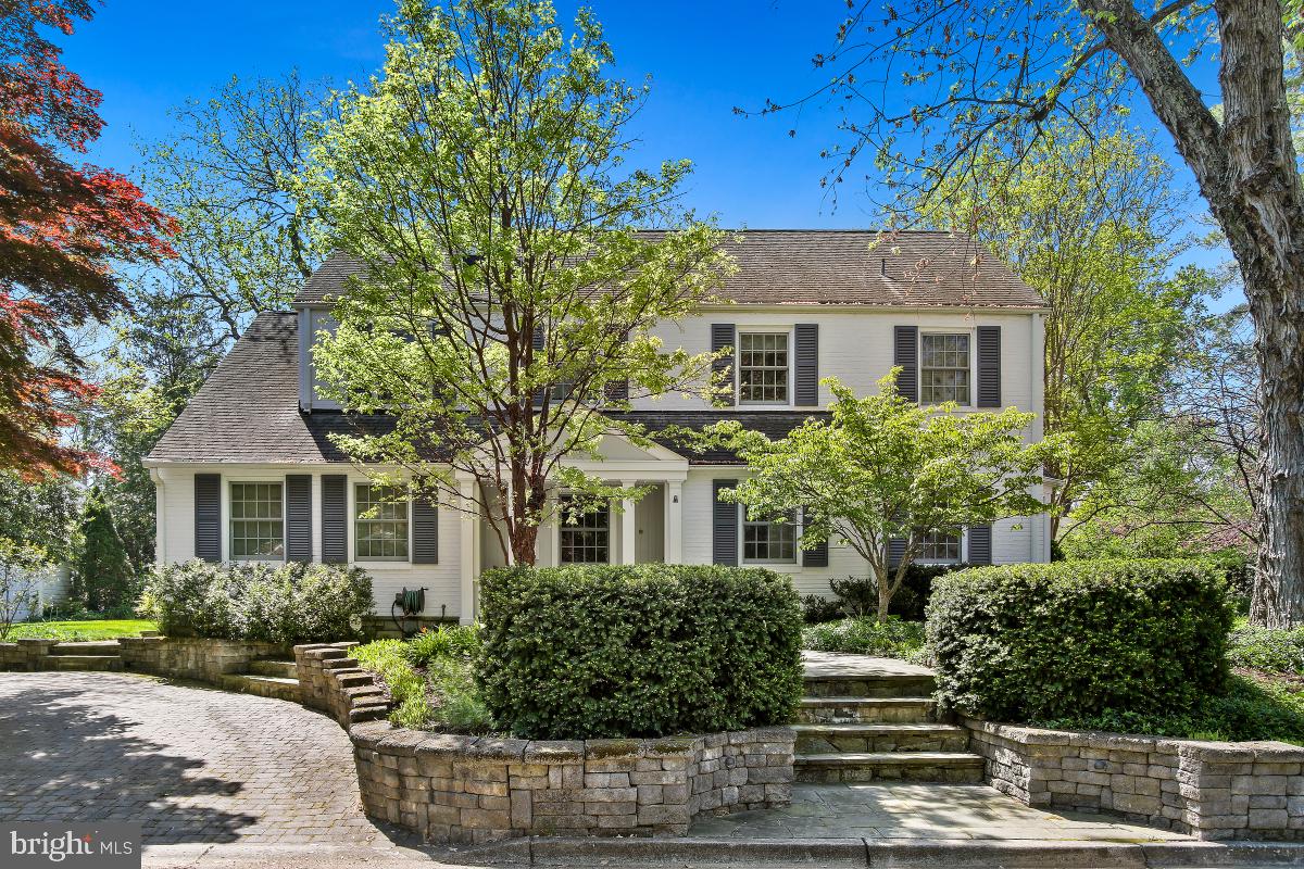 Beautifully Renovated and Expanded Colonial with four bedrooms, three full baths, and two half baths.  Located in the highly desirable Bradmoor neighborhood, this stately home offers a paved driveway and front courtyard accented with professional landscaping. Inside the front door, you are welcomed into the living room complete with a wood-burning fireplace and a spacious formal dining room with an oversized bay window and beautiful garden views. The chef-inspired kitchen includes a Thermador range, Wall Oven, Subzero refrigerator, and a GE Advantium Speed Oven. The Kitchen opens to the family room complete with custom built-ins and French doors to the back patio. There is also an office with pocket doors for extra privacy on the main level. Upstairs is the primary suite with a walk-in closet, and luxurious en-suite bath.  There is a second bedroom with an en-suite bath and access to the walk-up attic that includes a cedar closet. There are two additional bedrooms and a hall bath on this level. The Basement of this house offers another office space and conference/ game room,  with a gas fireplace, wet bar, and wine cooler. The basement also includes a half bath, laundry room, work room, and additional storage.  8403 Irvington is a must-see, move-in ready home located just a short distance to downtown Bethesda, NIH, and 495.