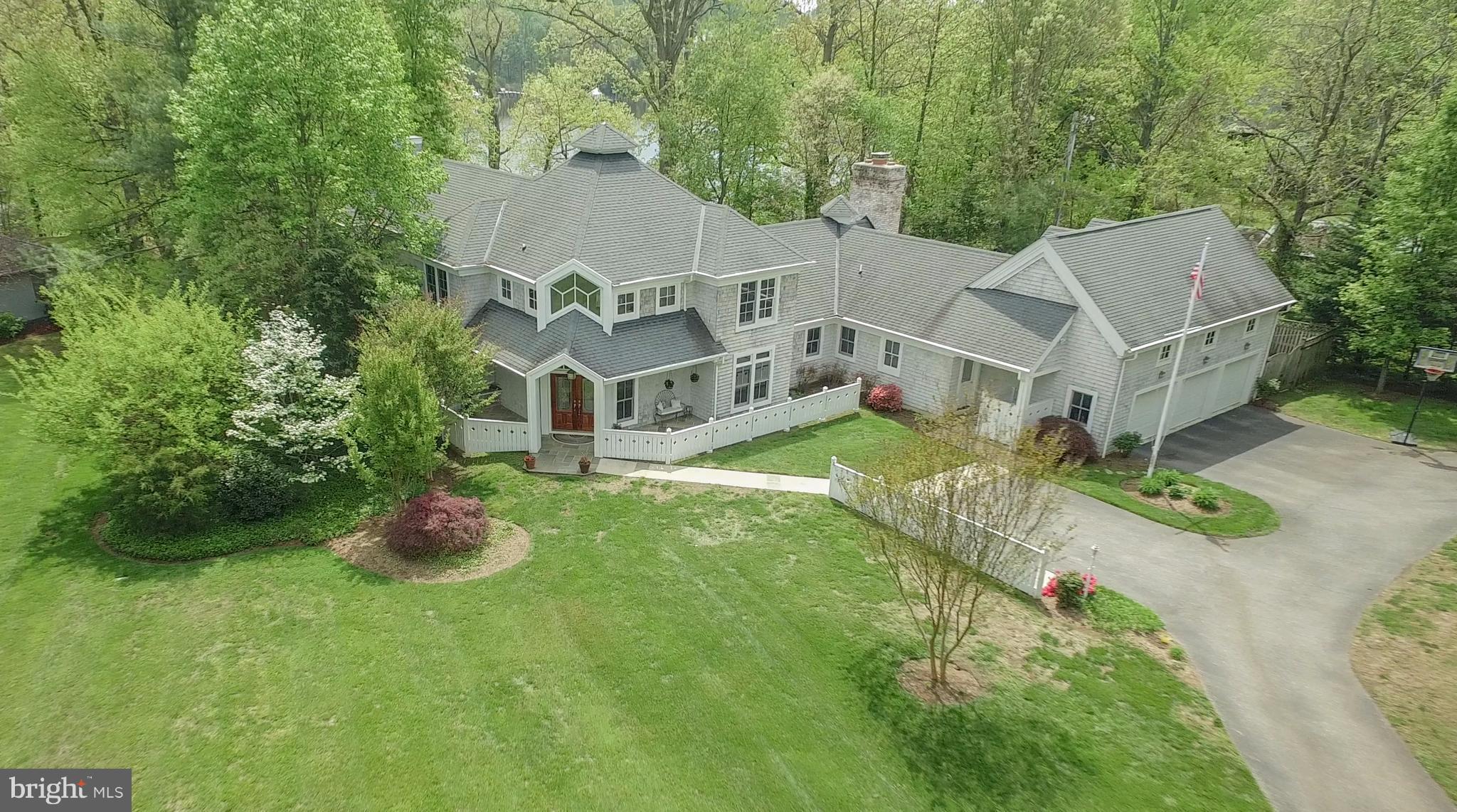 Nantucket Style WATERFRONT w/ Deep Water, Private Pier & multiple boat slips!  Right off South River in protected Crab Creek! Walls of Windows! Fantastic patio & porches to enjoy peaceful water views! 2 story Master w/library! 2 story FR! Open Floorplan! Expansive 4th Bedroom/Aupair Suite over 3 car garage($25K Buildout Allowance) Minutes from downtown Annap & Chesapeake Bay! Over 1 acre!